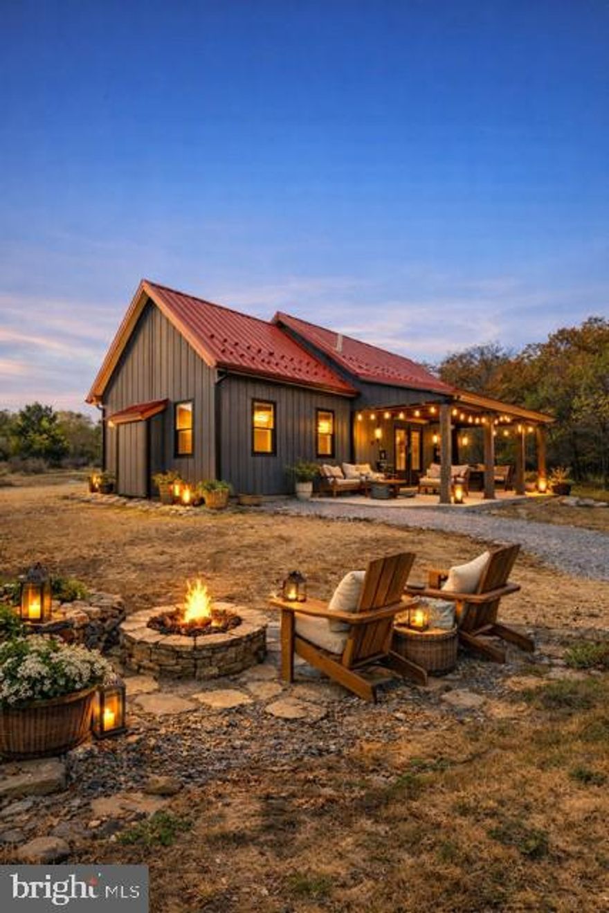 HOME IS NOW COMPLETED AND READY FOR ITS NEW OWNER! 
Custom-Built Barndominium on Sleepy Creek , a turnkey Luxury & Airbnb Income Potential property!
Welcome to Foggy Bottom, a one-of-a-kind custom-built Barndominium perfectly positioned on the banks of Sleepy Creek in beautiful Berkeley Springs, WV. This unique design with a  timber-framed great room, blends rustic craftsmanship with modern luxury, creating the ultimate getaway for personal enjoyment, or a lucrative short-term rental investment.
Step into the open-concept great room, where soaring ceilings, exposed beams, and a stunning stone fireplace set the tone for cozy gatherings. Expansive windows flood the space with natural light and frame breathtaking views. The gourmet kitchen boasts Hickory KraftMaid cabinetry, quartz countertops, a bold black island, and premium finishes, ideal for entertaining. The owner’s suite features a spa-inspired bath with a custom Onyx shower, while spacious secondary bedrooms and a versatile loft provide comfort for guests.

Outdoor living shines with a covered back porch, ribbed metal ceiling, and a private path leading to Sleepy Creek for kayaking, fishing, and nature watching. Built with durability in mind, steel siding, ribbed metal roof, seamless gutters, this home is designed to stand the test of time.

Looking for that next investment? Lets talk about Airbnb Potential!
Berkeley Springs is one of West Virginia’s fastest-growing short-term rental markets. This property’s creekfront location, modern rustic design, and high-end amenities position it perfectly to attract premium nightly rates and strong occupancy. Whether marketed as a romantic getaway, family retreat, or outdoor adventure basecamp, Foggy Bottom offers the potential for year-round income and impressive ROI, especially during the summer and fall peak seasons.
Whether you’re seeking a peaceful primary residence, a weekend escape, or a high-earning Airbnb investment, this Barndominium delivers it all in one exceptional package.