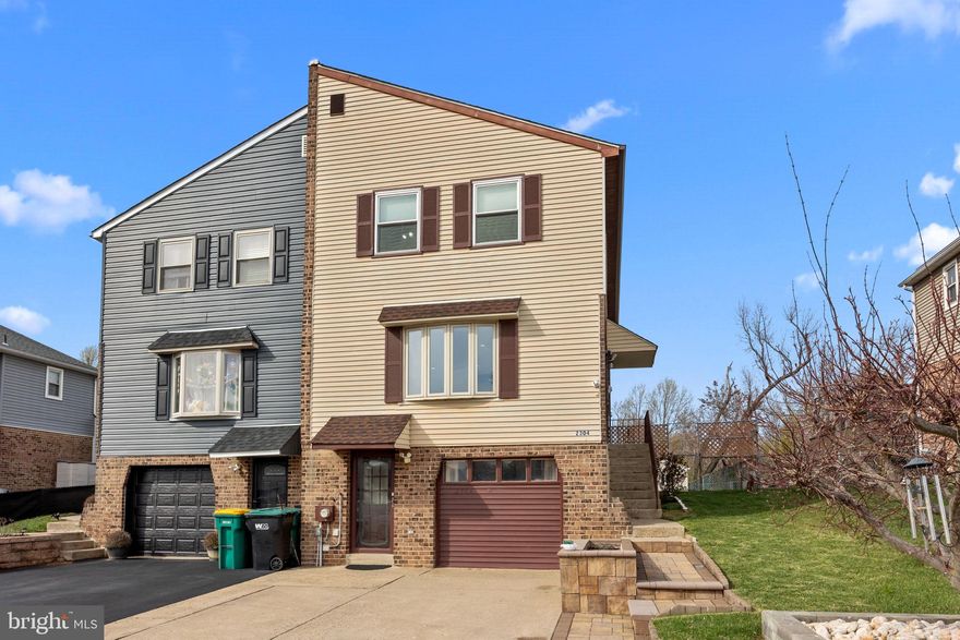 Welcome home to this spacious and lovingly maintained 3-bedroom, 2.5-bath twin located in the highly sought-after Hidden Valley neighborhood of Bensalem! Offering a perfect blend of comfort, convenience, and charm, this home features no association fees and easy access to I-95, Route 1, and the PA Turnpike—ideal for commuters and families alike. Step inside to find a sunken living room with beautiful hardwood floors, recessed lighting, and large front & side windows that fill the space with natural light. The remodeled eat-in kitchen is a true showstopper, boasting 42" wood cabinets with a range hood, a large granite island, ceramic tile flooring, stainless steel appliances, and a spacious pantry. The open layout flows seamlessly into the dining room, which leads directly to the private, fenced backyard. Outdoor living is at its best here, with a large, covered deck featuring skylights, a brick patio, and a shed for added storage. The peaceful wooded backdrop offers privacy and tranquility—plus, there's plenty of space for an above-ground pool, a kids’ play area, or hosting large gatherings with family and friends. Upstairs, the primary suite features an upgraded en-suite bathroom, while two additional generously sized bedrooms offer ample closet space and ceiling fans. A second full bathroom completes the upper level. The finished walk-out basement provides even more functional living space, including a possibility of second kitchen, a cozy stone fireplace, a powder room, laundry area, and direct access to the 4 cars driveway. The garage has been converted into an additional living area, perfect for a home office, gym, or bonus room. With recent updates like a new roof & gutters with leaf guards (2019), new HVAC (2017 by previous owner) , and a new water heater (2021), this home is truly move-in ready. Don’t miss this rare opportunity—schedule your showing today before it’s gone!