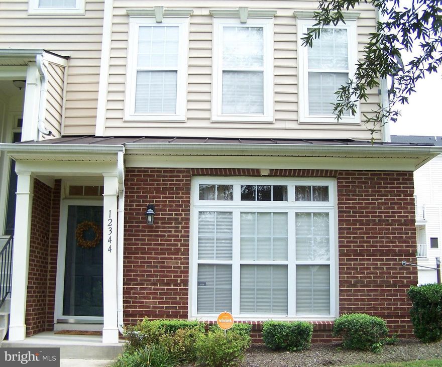 Semi - Detached, 2 story condo in tranquil setting among trees and facing pond.  Perfect home for 1st time Buyers or those down sizing.  Living Room has windows on 2 sides and a gas Fireplace.  Kitchen is almost new with stainless appliances from 3 to 12 months young. Prepare your food on Granite Counters, numerous Kitchen Cabinets.  Dining Area has  room for a table and a wall unit.  Note window in the stairwell.  Upstairs is an Open Family Room that leads to  a large Balcony, the width of the house.  Main Bedroom has windows on 2 sides and is large enough for several big furniture pieces.  There are 2 closets and en suite bathroom, which has double sinks, soaking tub and shower.  Second level also has another bedroom,  full bathroom and  laundry closet with 1 year old washer and dryer.  Attached 1-car garage plus parking in driveway.  Tucked away off of 202, by Watkins Park, easy commute to DC, near the Beltway.