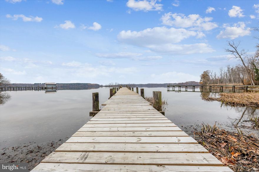 Wow!  Check it out!!  Dock access to water for small john boat or kayak; if you like to fish or just enjoy the water, this property is for you****Beautifully renovated detached home in quaint, quiet community. (Same price as a townhouse!!)  Renovated home with 3 bedrooms and 1 full bathroom on main level.  Lower level offers a bonus room with closet, full bath, kitchenette, recreation room or second living room.  The basement level features a walk-up entrance to the fully fenced back yard with sizable shed.  Home is set on nearly 1/2 acre!!!  New HVAC, plumbing system, recent hot water heater, sump pump and roof.  Huge asphalt driveway for 10 cars plus carport.  Inviting front porch overlooks large, flat front yard.  Dining room exits to back yard via sliding glass doors.  Del Mar Estates offers lighted streets, community well and access to private park like common area with pier and views/access of the water.  The community charges a $50 per month fee for unllimited water, maintenance of street lights and community park/dock.  House is approximately 300 sf larger than stated in public records on the main level.