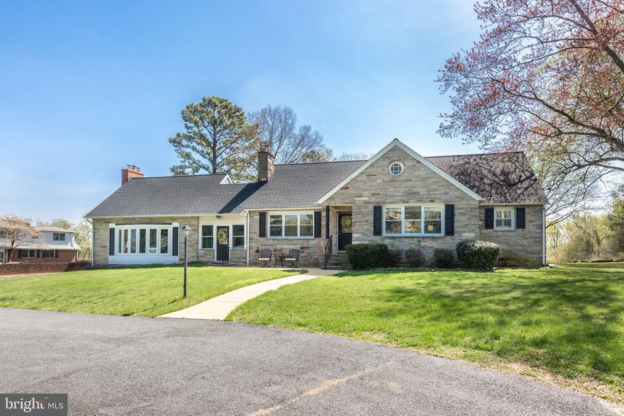 Welcome to 11501 Cedar Lane, a truly exceptional Cape Cod where timeless elegance meets modern comfort—perfectly situated on 4 acres. This stunning 3-bedroom, 3-bathroom home boasts a sophisticated flagstone exterior that immediately sets the tone for the quality and craftsmanship found throughout. Step inside to a massive living room designed for both relaxation and entertaining, featuring a cozy wood-burning insert that adds warmth and charm to the expansive space. At the heart of the home, you’ll find a breathtaking, fully updated kitchen that will impress even the most discerning buyer. Showcasing gleaming quartz countertops, a large center island, 42-inch cabinetry, and stainless-steel appliances, this space seamlessly blends style and functionality—ideal for everyday living and hosting alike.  Original hardwood flooring flows throughout the home, enhancing its modern yet classic appeal. The oversized 19x12 main-level primary suite offers the perfect private retreat, complete with a luxurious full bathroom and a spacious 11x9 walk-in closet with built in shelving. Upstairs and additional living areas provide well-appointed bedrooms and baths, offering flexibility for family, guests, or a home office setup.
Outside, the expansive 4-acre setting offers endless possibilities—whether you envision outdoor entertaining, gardening, or simply enjoying the peace and privacy of your own 60x20 concrete patio. 
This is more than a home—it’s a lifestyle defined by elegance, space, and comfort. Don’t miss your opportunity to own this one-of-a-kind property. Noted updates include: Roof (2018), A/C (2017), Water Heater (2018)