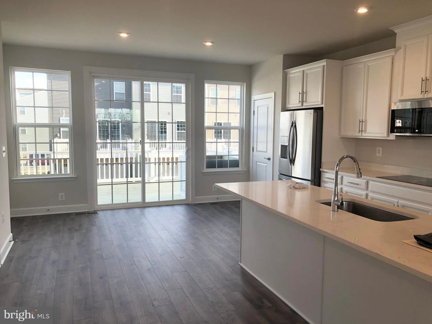 Almost new 2 car garage Stanley Martin Town home in the premiere Fredericksburg location of Central Park. This town home largest model that boast a distinctive open layout with a spacious great room, wood floors, designer kitchen with a 10 ft center island, large deck, Full basement with wood Floors, study and Full Bath. This home is perfect for entertaining and when you are not entertaining you will enjoy the close proximity of shops and restaurants including walking distance to Wegmans, relax at the pool and clubhouse, or work out in the fitness facility. Easy access to all major highways.