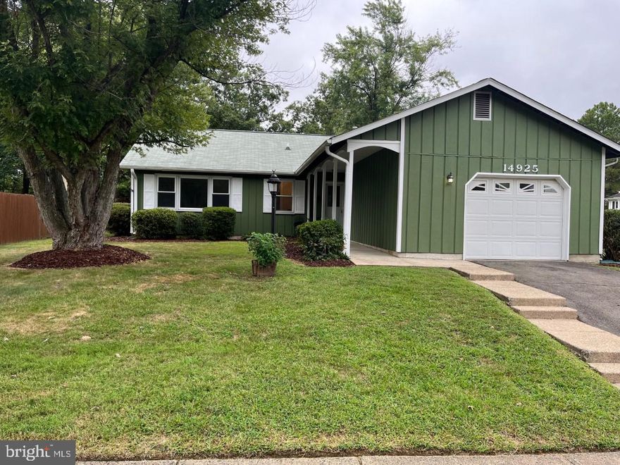 MOTIVATED SELLER!  Move-in ready one level living on a fabulous, spacious corner lot! Picturesque, wooded view across the street! Loads of updates to include fresh paint inside and out 2022; all bathrooms remodeled 2022; brand new high-quality Mannington LVP flooring throughout 2022; HVAC 2018;  washer and dryer 2017; all windows 2016; remodeled kitchen 2022 including light fixture, new stove and updated cabinets!  Exterior recently power washed! There is plenty of room to relax or entertain in the spacious living room or the family room offering a brick fireplace.  Primary bedroom has an attached full bath.   Sliding door leads out to the level, fully fenced back yard.  Oversized garage and driveway offer plenty of parking!  Great location, minutes to I-95 and Potomac Mills Mall!