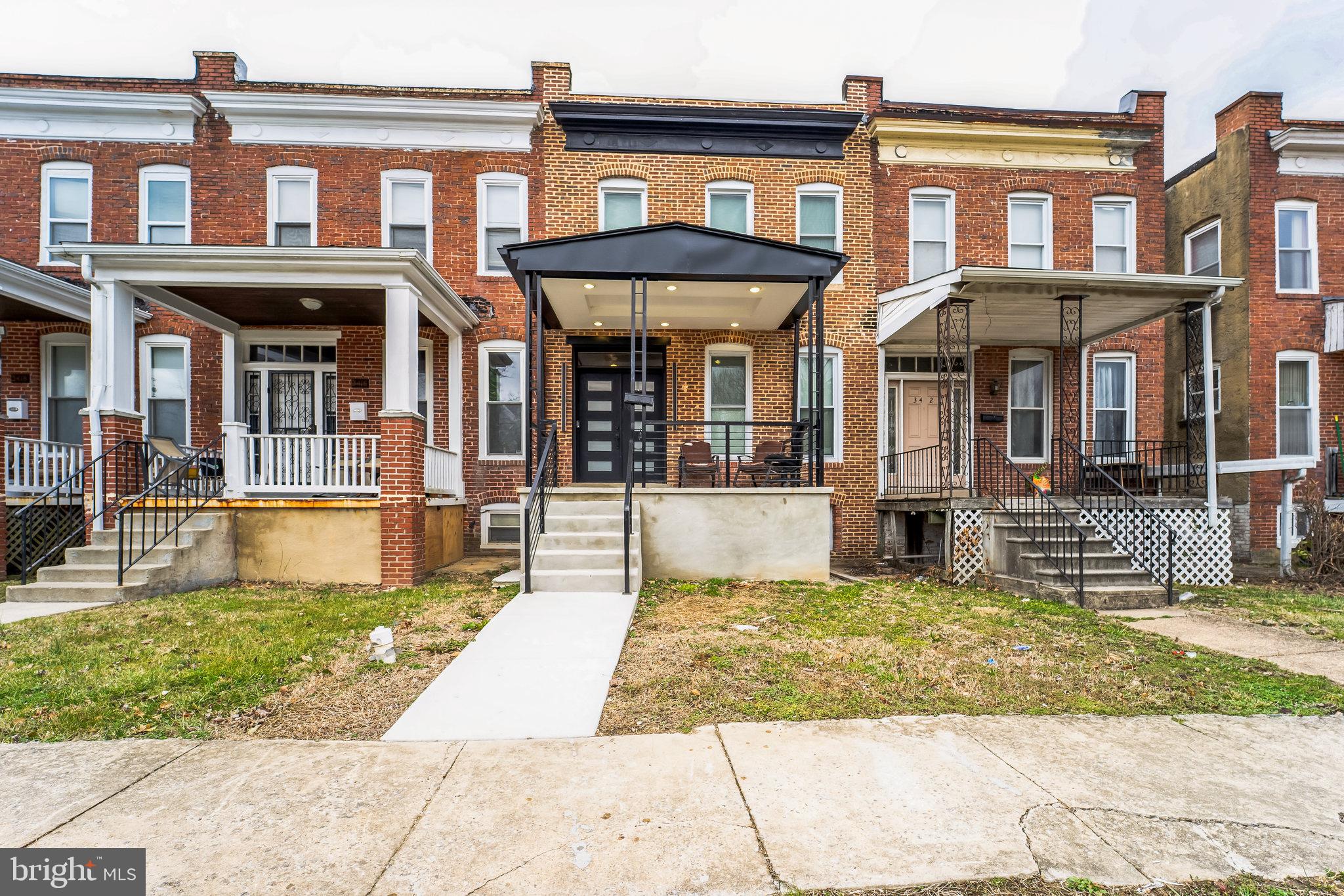 Discover this stylish and updated townhouse in Baltimore City! With 3 bedrooms, 2 full bathrooms, and a half bath, this home offers a modern, comfortable layout with plenty of space.
The main level features an open-concept design with sleek black-and-white finishes, recessed lighting, and stylish hardwood floors. The kitchen is a standout, with white shaker cabinets, stainless steel appliances, and a bold black marble backsplash. There’s also a convenient half bath on this floor.
Upstairs, you’ll find two spacious bedrooms with plenty of natural light and the two full bathrooms have modern finishes. The primary bedroom has its own balcony.
The finished lower level can be used as a third bedroom, rec room, or office.
Outside, enjoy the covered front porch, fenced backyard, and private parking pad. Other features include central air and custom black ceilings that add a unique touch.
Located in Baltimore City, this home is close to shops, restaurants, and local amenities. Schedule a tour today!