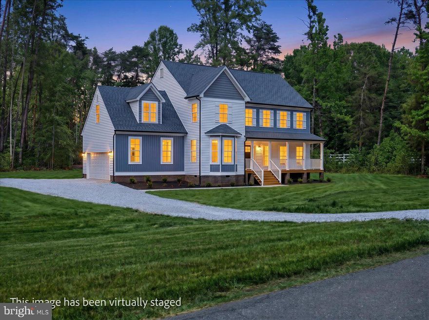 Designed for buyers who want space, style, and a true lake lifestyle without sacrificing comfort, 32 Mill Run delivers a rare combination of luxury finishes, massive square footage, and private lake access with covered boat slip A27 included.
Built by Danaf Homes, this move-in ready Lakeview model sits in the Mill Run community on the private side of Lake Anna and brings together refined design with the kind of everyday functionality buyers wish more homes actually had.
From the moment you pull in, the home makes an impression. Crisp architectural lines, upgraded exterior finishes, a welcoming covered front porch, and a wooded backdrop create a setting that feels private, polished, and substantial.
Inside, the scale of the home immediately stands out. The main living areas were designed to feel open, bright, and connected, with oversized windows, luxury vinyl plank flooring throughout, upgraded trim work, and a seamless flow built for both entertaining and everyday living. The kitchen anchors the home with an oversized quartz island, farmhouse apron-front sink, double wall ovens, upgraded cabinetry, walk-in pantry, and an incredible amount of prep and storage space that most new construction homes simply do not offer.
The great room feels expansive yet comfortable, centered around a gas fireplace with custom surround details and direct access to the outdoor living space. A separate flex space with French doors offers endless possibilities for a private office, formal dining room, media room, or additional lounge space depending on how you live.
Upstairs, the primary suite feels more like a private retreat than just another bedroom. The spa-inspired bath features upgraded tile selections, oversized glass shower, dual vanities, matte black fixtures, and elevated finishes throughout. Secondary bedrooms are generously sized, and the massive upper-level recreation space gives flexibility for guests, bunk room setups, game nights, fitness equipment, or a second living area. It is the kind of bonus space people walk into and instantly start planning how they would use it.
And then there’s the part that makes Lake Anna living what it is. Covered boat slip A27 gives you direct access to the private side of the lake for long weekends on the water, quiet morning cruises, tubing days with friends, and sunsets that somehow never get old.

This is not builder-basic. It is a thoughtfully upgraded luxury lake-access home with the size, layout, and lifestyle today’s buyers are chasing, without the wait of new construction.

32 Mill Run gives you the space to spread out, the upgrades people actually want, and the kind of lake life that feels easy the second you arrive.