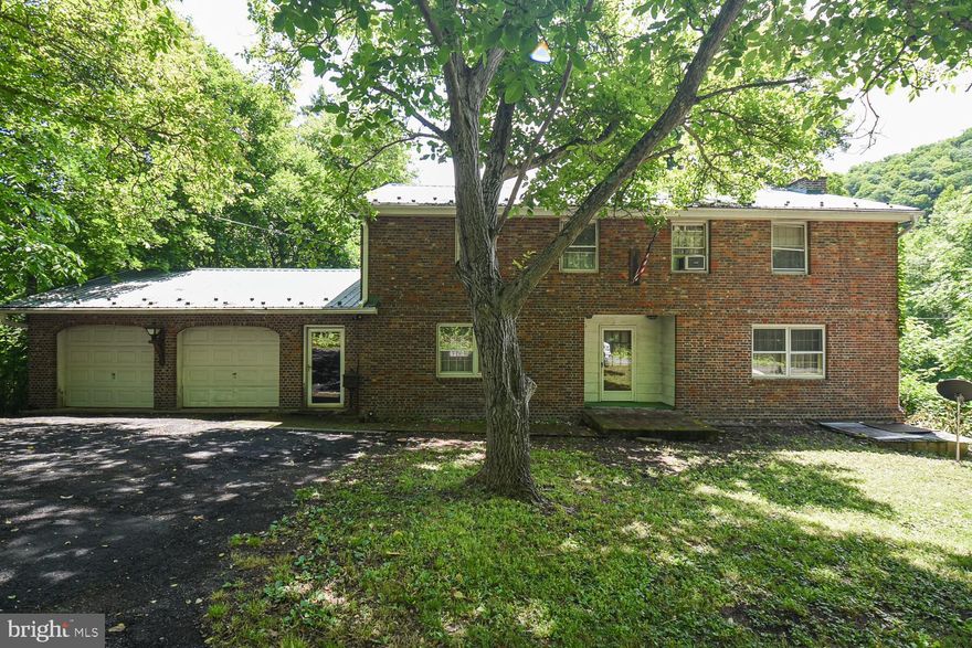 3 beds, 1 bath, 2 car attached garage w/ automatic openers!  FULL unfinished walk-out basement!  FIRST FLOOR laundry!  MASSIVE living room with hardwood floors!  HUGE front bedroom that spans the entire length of the house!  The foundation is in need of repair, being sold strictly as-is.