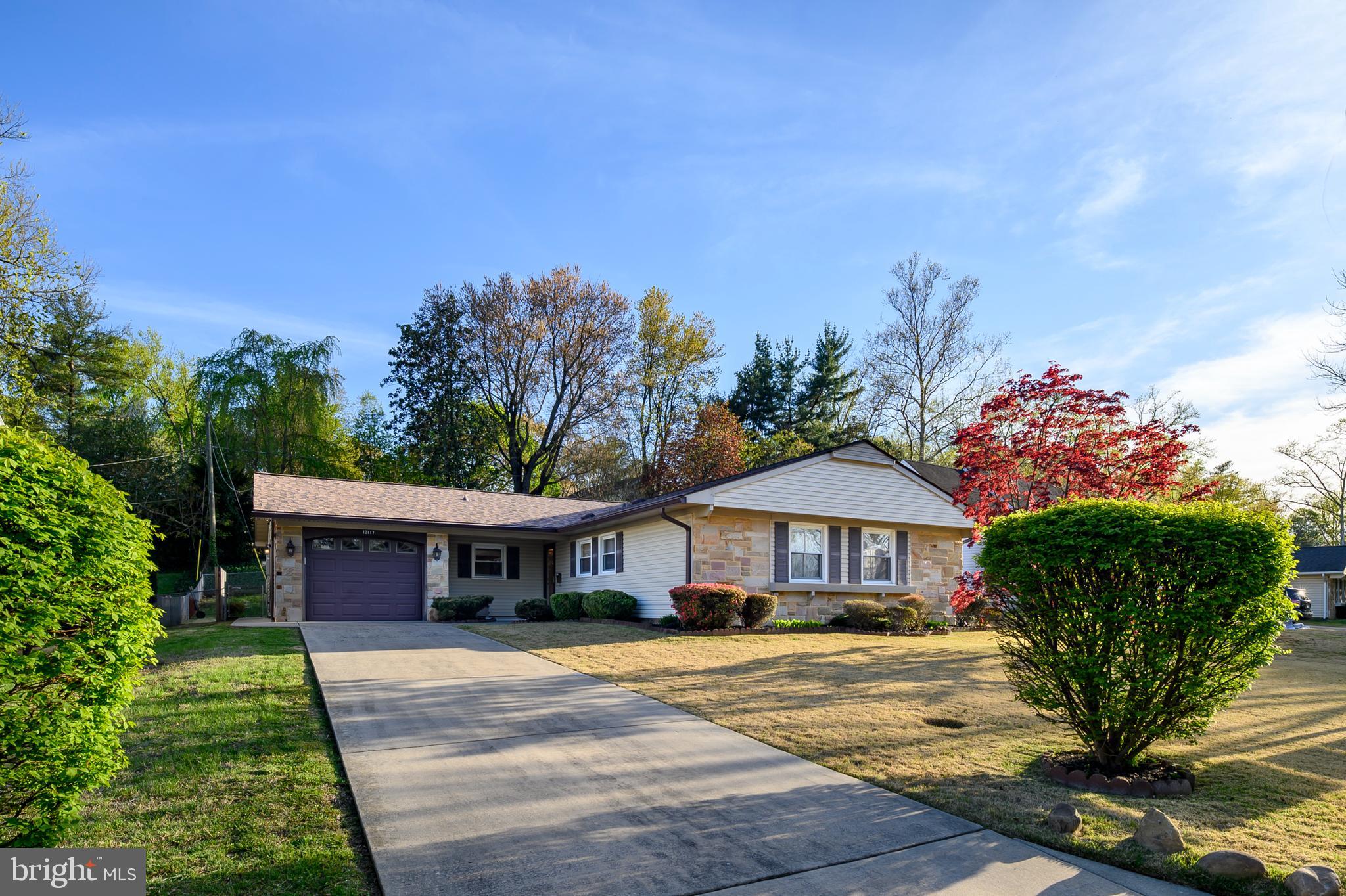 Start your next chapter at 12117 Tawny Lane!
This charming Levitt-built rancher in the heart of Tulip Grove at Belair offers solid construction, a comfortable layout, and a warm, inviting atmosphere. The spacious family room addition, complete with a cozy brick-front fireplace and golden-toned paneling, provides the perfect place to relax or gather with loved ones. Well cared for and ready for its next owners, this home invites you to move right in and add your own personal touches over time.
Nestled on a quiet, tree-lined street, Tulip Grove is a friendly, established neighborhood close to parks, museums, popular restaurants, schools, and the Belair Bath and Tennis Club (membership required). With its classic charm and great location, this is a wonderful place to call home. Come fall in love with all that 12117 Tawny Lane (and Bowie) have to offer! Remember NO HOA here!