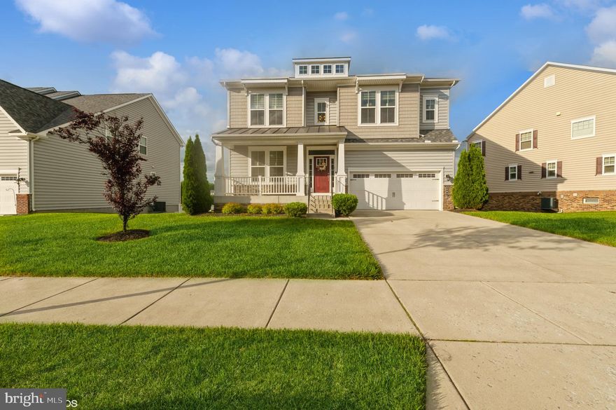 STUNNING  5BR/4.5BA COLONIAL WITH GORGEOUS WATER VIEWS THROUGHOUT!  OPEN CONCEPT LIVING ON THE FIRST FLOOR WITH A HUGE GREAT ROOM WITH FIREPLACE; BEAUTIFUL GOURMET KITCHEN WITH GRANITE COUNTERS, CERAMIC BACKSPLASH, LARGE ISLAND WITH PENDANT LIGHTING, STAINLESS APPLIANCES & PANTRY; DINING AREA WITH DOORS LEADING OUT TO THE MAINTENANCE FREE DECK OVERLOOKING THE QUARRY; STUDY WITH CROWN MOLDINGS & WAINSCOTING.  THE UPPER LEVEL FEATURES AN EXPANSIVE MASTER SUITE WITH VIEWS OF THE QUARRY, SITTING AREA, WET BAR WITH MINI FRIDGE, 3 WALK-IN CLOSETS & LARGE EN-SUITE BATH; 3 ADDITIONAL BEDROOMS; 2 BATHS & LAUNDRY ROOM.  THE WALK-OUT LOWER LEVEL HAS A FAMILY ROOM WITH WET BAR, BUILT-IN WINE RACK & MINI FRIDGE; ADDITIONAL BEDROOM; FULL BATH & TONS OF STORAGE SPACE.  COVERED FRONT PORCH & 2 CAR GARAGE.  COMMUNITY FEATURES INCLUDE A WALKING TRAIL AROUND THE QUARRY, FENCED DOG PARK & MORE.  GREAT CONVENIENT LOCATION!