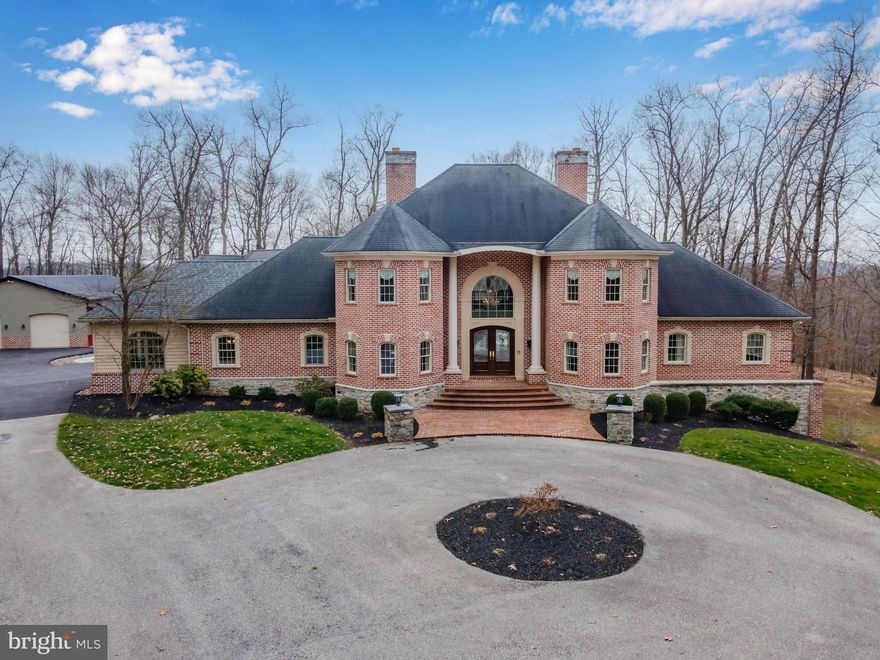 Discover the ultimate in luxury living at 750 Windrush Drive, where modern sophistication meets rural tranquility. This magnificent 10,000 sq ft contemporary home is nestled on a private 10+ acre lot in the highly sought-after Dallastown School District.
Upon entry, be welcomed by a grand 2-story foyer, leading to an open floor plan throughout. Entertain guests in the breathtaking 2-story living room, complete with a cozy gas fireplace. The gourmet kitchen and butler's pantry feature an abundance of upgraded features, ideal for the aspiring chef.
All bedrooms boast full bathroom access and walk-in closets, perfect for providing privacy and convenience to guests or family members. The stunning primary suite is the epitome of luxury, complete with a one-of-a-kind primary bath that will leave you feeling pampered and refreshed.
Take entertaining to the next level in the finished lower level, complete with a full bathroom and exercise room, ideal for a home gym or game room. Relax in the private patio or take a dip in the in-ground pool, while enjoying the breathtaking views of the spacious yard.
In addition, recently added horse stables offer equestrian enthusiasts the perfect space to keep and care for their beloved animals. With its luxurious amenities and serene setting, 750 Windrush Drive is the perfect place to call home!