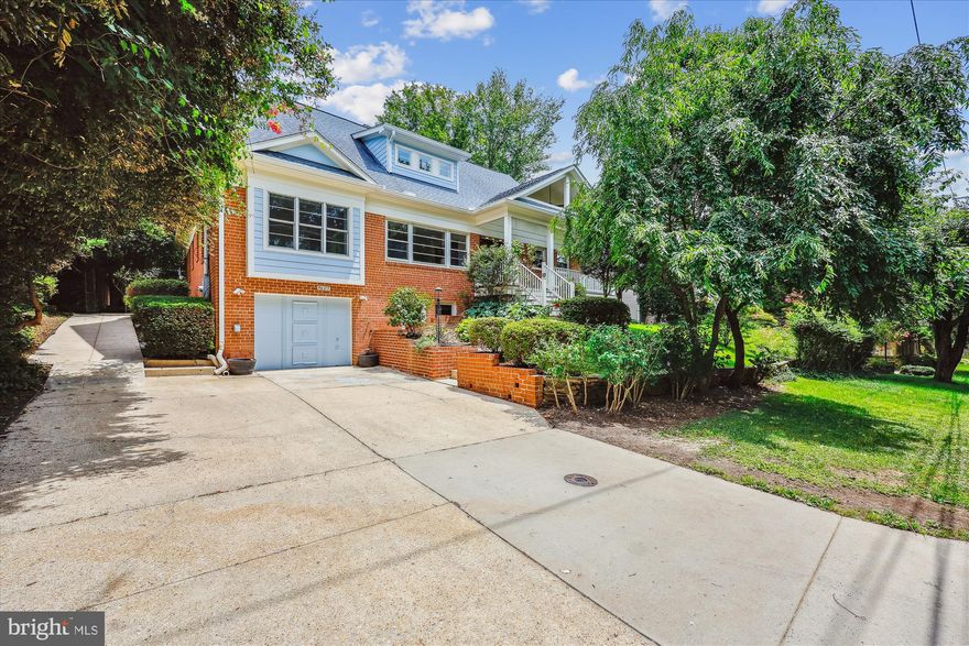 Welcome to 5407 Kirkwood Drive—a rare opportunity to own a fully remodeled and thoughtfully expanded Craftsman with an in-ground pool, ideally situated just minutes from Westbard Square Shopping Center, Little Falls Catholic School and Wood Acres elementary school. Originally built in 1955 and later enhanced with a substantial addition, this exceptional residence seamlessly blends classic charm with modern amenities. Inside, you’ll find refined finishes, detailed moldings, designer lighting, hardwood floors, expansive windows, luxurious bathrooms, and striking architectural elements throughout. Every aspect of the home has been carefully considered and upgraded.
A gracious covered front porch sets the tone, offering an ideal space for morning coffee or neighborhood chats. Step into a welcoming foyer that leads to a bright living room with a brick fireplace and a contemporary light fixture. Just beyond lies the heart of the home: an extraordinary chef’s kitchen and adjoining breakfast area.
The renovated kitchen showcases a premium GE Monogram stainless-steel appliance suite, blue Bajia granite countertops, a built-in buffet with dual-drawer refrigerator and glass front cabinetry, oversized side-by-side refrigerator, six-burner gas cooktop with hood, Dacor warming drawer, recessed lighting, Maple cabinetry with soft-close features, a sleek glass subway tile backsplash, and generous counter space for meal prep. A convenient laundry chute in the kitchen allows for easy drop-off to the lower-level laundry area.
Beyond the kitchen are the elegant dining room, inviting sitting room, and sun-drenched sunroom—creating exceptional flow and beautiful sightlines. The expansive dining room includes glass display shelves, the sitting room features a fireplace flanked by built-ins, and the sunroom is accented by casement windows that frame views of the pool. The main level also includes a serene primary suite with a private sitting room, highlighted by a unique stained-glass feature also visible from the sunroom. This well-conceived layout provides a dedicated retreat, complete with an en-suite bathroom and a generous bedroom. The luxurious full bath offers a soaking tub and a glass-enclosed shower with two niches, a bench, and a handheld wand.
Completing the main floor is a renovated hall bathroom with handheld bidet sprayer, a sunlit bedroom, and two closets.
Upstairs, two additional bedrooms boast hardwood flooring, recessed lights, crown molding, and organized closet systems. A renovated full bath with a steam shower and a double vanity serves this level. A versatile lounge area and an additional guest room or office with gabled ceilings, a Juliet balcony, and tranquil pool views complete the upper level.
The lower level expands the living space even further, with a recreation room offering a fireplace and walk-in closet, a flexible bonus area with a bar and built-in bench, a private fifth bedroom with direct access to the side yard, and a full bathroom with both a soaking tub and a glass-enclosed shower. A spacious laundry room with cabinetry and entry to the tandem garage with a radiator for heating that can fit 3 compact cars and has an electric car charger—featuring a second refrigerator, freezer, and additional built-in storage—rounds out this level.
Outside, the meticulously landscaped grounds include mature trees, vibrant plantings, front gardens, stone pathways, and extensive stone and brick hardscaping. A generous patio offers additional space for entertaining, while the pool with an electric retractable cover and adjacent mini sports court provide recreation and relaxation for all ages.
This location is unmatched—just moments from the revitalized Westbard Square and minutes to Downtown Bethesda. Nestled in the friendly and well-established Westwood neighborhood, you’ll enjoy easy access to shopping, dining, grocery stores (including Giant and Whole Foods), and entertainment.