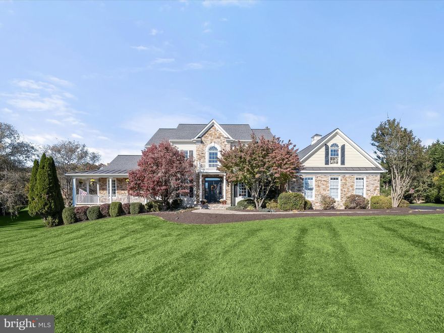 Nestled on over 2 acres of lush green grounds in the prestigious Wellington area of Glenwood, this home invites indoor and outdoor living and entertaining venues large and small. Outside, extensive paver walks escort guests to a covered stone front porch or a secondary side porch that welcomes family and friends. A hallmark wrap-around stone front porch in front, and a low-maintenance wrap-around rear deck, hot tub and screened porch overlook a glistening, heated in-ground pool with waterfall and spa. 

Perfectly designed for robust living and entertaining, this majestic setting offers resort-styled outdoor amenities and interior spaces to accommodate lifestyle, flexibility and comfort.  Inside, gleaming hardwood floors adorn the foyer, formal dining room, private study, and family room. 
The open plan design showcases a gourmet kitchen with a commanding entertainer’s island at center, and a Wolf gas cooking station and range hood for the chef of the house. Plate your creations and dine formally in the dining room, casually in the breakfast nook, screened porch, or dine alfresco on the deck or poolside under the pavilion. 

A primary bedroom and completely updated luxury bath suite are privately located in a wing on the main level with private access to the wrap around side and rear deck and hot tub.  Special moments on the main level also include an open plan family room with a cozy stone fireplace, a sunroom with a vaulted ceiling and windows where light streams in to brighten each day. Relaxing days poolside, and action-packed fun days splashing in pool are low maintenance with easy access to a newly upgraded side entry mud room and laundry center where pool linens can be easily laundered. From the main level, there is also a secondary stair from the kitchen to the upper-level landing, adding private accessibility to four more secondary bedrooms, served by two adjoining dual entry J & J baths, and a private vanity for each bedroom.

Downstairs, a finished lower level features a recreation room with full daylight and a walk out slider door leading to a covered patio, and paver walk to the rear lawn, pool and pavilion. Guests will also enjoy a festive beverage from the wet bar, or wine room, and a game of pool in the adjacent billiards room. The lower level is completed by a dual entry full bath and private guest quarters. 

Come home and decompress in the fold of extraordinary outdoor living spaces, lush, expansive grounds, mature trees and luxury interiors offering lifestyle options, flexibility and special moments at every turn!