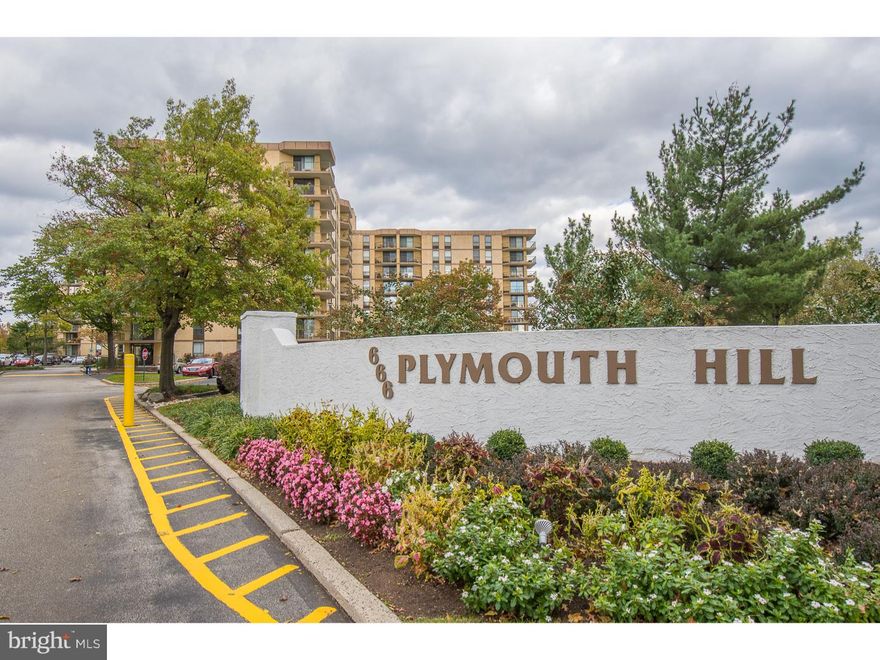 Welcome Home to the largest 2 bedroom 2 bath Condo Unit available at Plymouth Hill.  This elegant and spacious home has 1518 sq. ft. of living space.  Enter the elegant foyer and den with wood floors, an entertainment bar and an expansive pantry that houses a second refrigerator/freezer.  The living room has great views and leads into an open dining room and beautifully appointed kitchen.  The tremendous master suite has a wall of closets and a separate walk in closet and master bath.   The second bedroom is equally impressive with an in-suite bathroom.   A stackable washer and dryer are included with the sale of this property, as well as all appliances, window treatments and ceiling fixtures.  This central location is a commuters dream just minutes from the PA Turnpike, Blue Route, Schuylkill Expressway, and 3 miles Northwest of Philadelphia.  Shopping and restaurants await you within walking distance of the Plymouth Meeting Mall.   This beautifully landscaped, gated community offers numerous amenities available for your enjoyment such as a heated pool, tennis courts, fitness gym, basketball court, library, party room, and a 24-hour gated security guard.  The condo fee includes A/C, heat, water, sewer, electric, and basic cable.