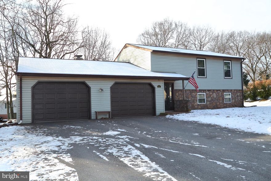 You'll appreciate all the space in this unique home. The main floor boasts of total openness with newer vinyl hardwood. Step into the family room with wood burning fireplace and access to a huge sunroom. Tucked away on the main level is an office area. Upstairs you'll feel the sunshine thru with new windows in entire home. Fantastic corner lot to roam around in. Lots of storage in the over sized garage. Mini-split systems provide A/C to home.  A single home to call yours