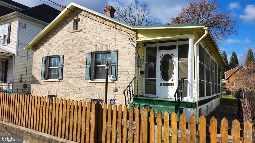 This charming ranch-style home, constructed in 1920 and built to last, offers a perfect blend of classic character and modern convenience. Step inside to discover a cozy interior featuring large, updated windows allowing ample sunlight. The well-appointed kitchen comes equipped with essential appliances, including a refrigerator, stove, dishwasher, and convenient laundry facilities in the basement. With two inviting bedrooms and one and a half bathrooms, this home is designed for easy living. The full basement provides ample storage and potential for customization. Outside, the level lot features a spacious rear yard, perfect for outdoor gatherings or gardening. Or relax on the 280+ sqft, screened porch. Parking is a breeze with a detached garage and additional on-street options. With its size, price, and features, this property is ideal for the first home buyer or investment opportunity. Located within 5 miles of a commuter rail station, this home is ideal for those seeking a peaceful retreat with easy access to urban amenities. Experience the warmth and comfort of this delightful property in the heart of Martinsburg.