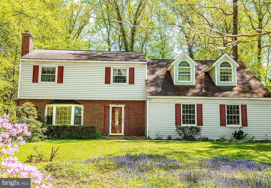 Welcome to this spacious 4-bedroom, 3 full and 2 half bath home offering a flexible layout and great potential. Step into the foyer featuring tile flooring and a convenient entry closet. To the left, the living room offers a cozy wood-burning fireplace with a new liner and built-in shelving. Continue into the kitchen, complete with oak cabinetry, laminate countertops, tile flooring, and a drop ceiling. The adjacent dining room features hardwood floors, chair rail, and wallpaper accents, creating a defined space for dining & entertainment. Just off the kitchen, the family/sun room provides a bright and inviting gathering space with multiple skylights, a wood-burning insert with fan, and a combination of tile and laminate flooring. A full bath addition is located off this area, adding extra convenience. The main level also includes a laundry room with ample cabinetry and access to a mudroom area with an additional half bath. Upstairs, the primary bedroom features vaulted ceilings and a large walk-in closet. The en-suite bath includes tile flooring, a vanity, a skylight, and a shower stall. Three additional bedrooms offer a mix of hardwood and carpet, with one bedroom featuring its own half bath and another offering multiple closets and access to the primary suite. A hall bath with a tub/shower combo serves the remaining bedrooms. The lower level includes an unfinished basement with a drop ceiling and plenty of room for storage or future improvements. Additional features include pull-down attic access, a 2-car garage with storage, well water, and public sewer. The home is serviced by an oil boiler with baseboard heat (3 zones), central A/C (approximately 1–2 years old), and multiple water heaters. Perfectly situated just minutes from downtown Bel Air, this home offers the best of both worlds—convenient access to shopping, dining, and everyday amenities, all while tucked away in a quiet, wooded setting with no HOA.