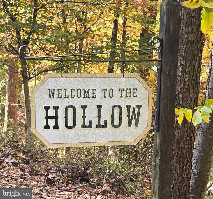 Your Own Private Paradise on 18+ Acres
Discover the perfect blend of comfort, craftsmanship, and natural beauty in this expansive ranch home set on over 18 secluded acres. With a barn, small pasture, oversized 2-car detached garage, workshop, and peaceful pond, this property offers endless opportunities for hobbyists, homesteaders, or anyone seeking true tranquility. Step inside to find custom tulip poplar trim throughout, harvested right from the property—an artisan touch that sets this home apart. The generous primary suite features serene picture windows overlooking the woods and wildlife, along with a luxurious 3-part walk-in closet and a spa-like primary bath complete with jetted tub, double vanity, and separate shower. 
The living room is warm and inviting with its propane fireplace, beamed ceiling, and built-in bookshelves, creating a perfect gathering place. The eat-in kitchen offers rich charm with dark wood flooring, cherry cabinetry with dressed appliance panels, granite countertops, a skylight, and pantry. A spacious dining room easily accommodates a large farm table plus additional furnishings. 
Nearly every room on the main level accesses the balcony deck, ideal for enjoying morning coffee or evening sunsets. The second bedroom is currently used as an office, and sits next to the second full bath.
The finished lower level extends the living area with two additional bedrooms, a cozy sitting room with fireplace, hobby room, office, full bath, and a full-sized family room featuring a wood-burning fireplace. Multiple walkouts lead to a long patio beneath the upper deck, offering generous outdoor living space.
Additional features include:
• 1000-gallon propane tank backing up the heat pump
• Whole-house generator for peace of mind
• Life alert style–enabled security system. Serviced by Secure Wire.
• Pond with plentiful sunnies and frogs—a perfect spot for quiet reflection and appreciating your surroundings
This exceptional property is more than a home—it's a retreat. Come experience the beauty, privacy, and possibilities of life on your own secluded acreage. If you are a hunter or a photo hunter there is plentiful game, especially deer and turkeys, and bluebirds stay year round and nest here year after year!