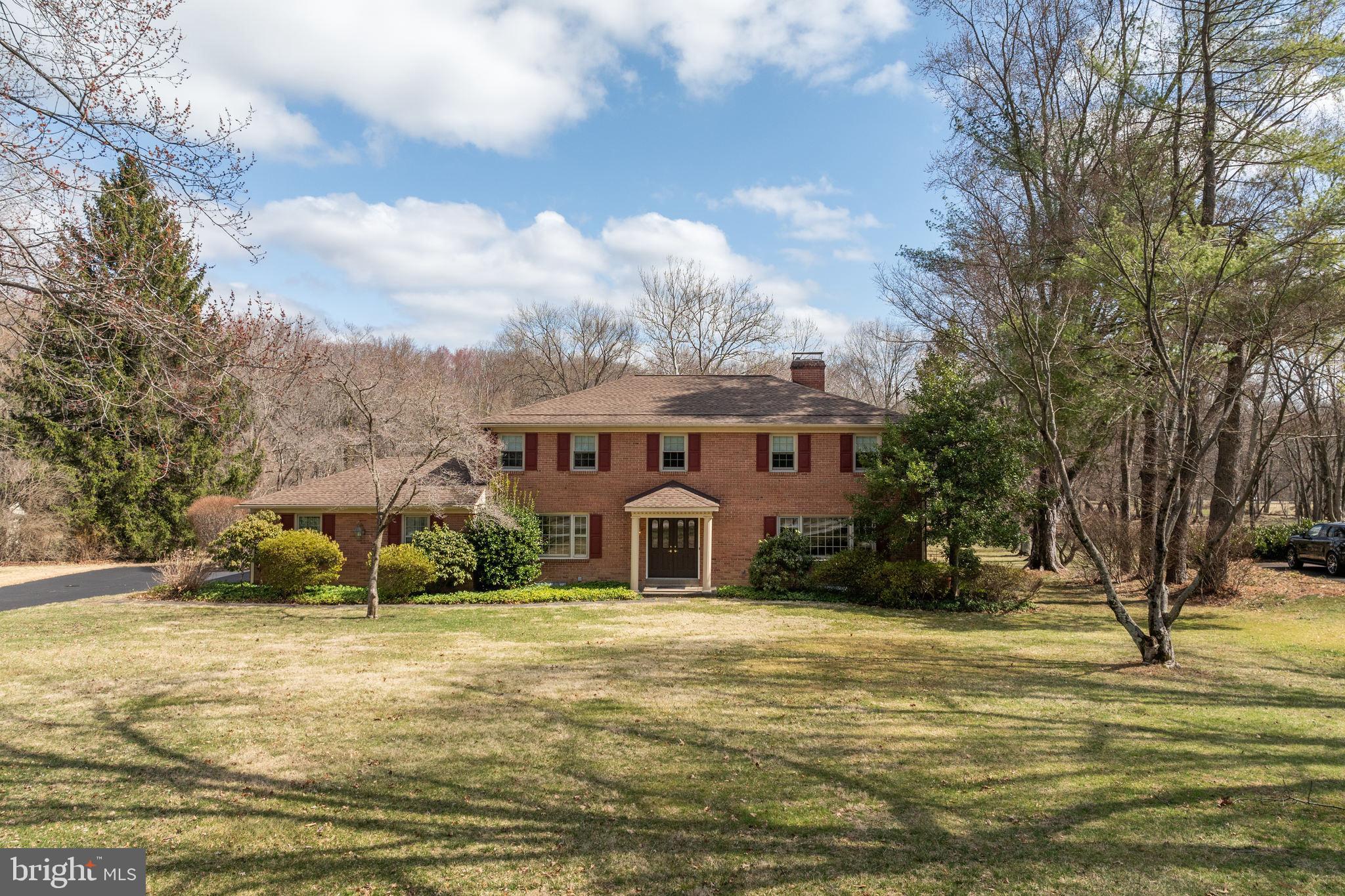 Nestled in one of the most highly sought-after neighborhoods in Newtown Square, 857 Hunt Road offers an incredible opportunity to own a beautiful Colonial in the coveted Radnor Township School District. Set on a picturesque 1.42-acre lot, this 3,120-square-foot home has been lovingly maintained by its original owners since it was built in 1969.
Step through the inviting foyer into the formal living room, where a wall of windows fills the space with natural light, complemented by a cozy fireplace. To the left, the formal dining room provides an elegant setting for gatherings and celebrations.
The rear of the home is designed with comfort and connection in mind. The eat-in kitchen features a bright breakfast area with sliders leading to a three-season room, surrounded by windows to take in the tranquil views. Adjacent to the kitchen, the spacious family room boasts bay windows, a brick fireplace, built-in bookcases, and a charming bar — making it the true heart of the home. A dedicated laundry room and powder room are conveniently located off this space.
Upstairs, the expansive primary suite features ample closet space and a private ensuite bath. Four additional generously sized bedrooms and two full bathrooms complete this level, ensuring comfort and privacy for everyone.
Outside, the sprawling lot offers a serene retreat with endless possibilities for outdoor enjoyment. This prime location provides effortless access to major highways, ensuring a smooth commute, while the charming towns of Wayne and Newtown Square are just minutes away, offering premier shopping, dining, and entertainment.
Don’t miss this rare opportunity to own in such a prestigious and convenient location — schedule your showing today!