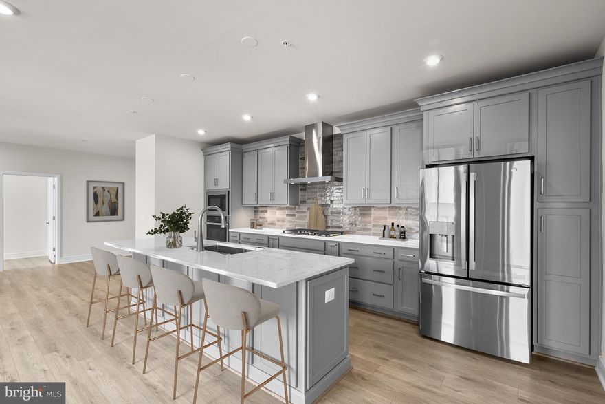 Introducing one of the latest gems from Van Metre Homes – the GRIFFIN V floorplan! Conveniently located and meticulously crafted, this brand new incredible ACTIVE-ADULT (55+) CONDOMINIUM by Van Metre Homes at BIRCHWOOD is available for you to call home IMMEDIATELY! This stunning condominium offers an expansive 1,969  finished square feet of living space all on one level with lofty 9' ceilings, providing the perfect blend of comfort and style. Step inside to discover a haven of natural light that floods the interior, creating a welcoming atmosphere as you effortlessly move between the main living areas, private study, and the piece-de-resistance—the spectacular premier kitchen featuring a central island, upgraded cabinets, quartz countertops, tile backsplash, and stainless steel appliances. Indulge in the luxury of the primary suite, complete with a generous walk-in closet and a spa-like, 4-piece bathroom featuring double sinks and a large, frameless shower enclosure with a built-in seat – the perfect retreat after a long day. The two additional bedrooms and full bathroom are perfectly suited to meet your needs and complement your lifestyle. Additionally, this residence includes a 1-car garage with electric car charging capabilities, providing both security and convenience for your vehicle. Being a new build, your home is constructed to the highest energy efficiency standards, comes with a post-settlement warranty, and has never been lived in before! Don't miss out on the opportunity to experience the ultimate in modern living in this exquisite home. Schedule an appointment today! ----- Located in Northern Virginia, Birchwood at Brambleton is an Active Adult (55+) community that offers one-level condominiums and spacious single-family homes. Residents benefit from its close proximity to Brambleton’s restaurants, shopping, movies, and community events. The community boasts top-notch award-winning amenities like indoor and outdoor pools, bocce and pickleball courts, a fishing pond, and a golf simulator. Additionally, Birchwood at Brambleton’s convenient location places it just minutes away from Metro’s Silver Line, Dulles International Airport, commuter routes, and health centers, making it a prime destination for those seeking a well-connected and vibrant lifestyle. ----- Take advantage of closing cost assistance by choosing Intercoastal Mortgage and Walker Title. ----- Other homes sites and delivery dates may be available. ----- Pricing, incentives, and homesite availability are subject to change. Photos are used for illustrative purposes only. The community lies within the Airport Impact Overlay District (within the 1 Mile Buffer). Due to its proximity to Dulles International Airport, this site is subject to aircraft overflights and aircraft noise. For details, please consult the Community Experience Team.