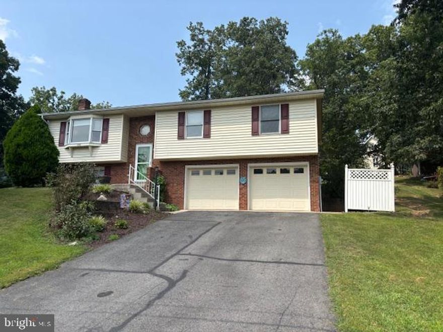 Welcome to 298 Leon Drive in Fort Ashby, West Virginia! This split foyer single-family home with a large yard and pool is waiting for you! The main level features an open-concept kitchen, living, and dining area, along with all three bedrooms and two full bathrooms. The master bedroom has ample closet space and an ensuite full bathroom. The lower level includes a two-car garage, a bonus room with a half-bath, and a laundry room. Off of the dining room the glass door leads you out onto a concrete patio and pathway leading to a 30ft long pool. The pool features a hot tub that waterfalls in to heat the pool. The pool has a 4ft shallow area that gently slopes into the 8ft deep end. Surrounding the pool is a spacious concrete slab, providing room for lounging and entertaining. Lush landscaping frames the area, adding vibrant greenery, and a large vinyl fence offers privacy from neighbors. A stylish cabana house offers a shaded retreat, perfect for relaxing or hosting guests with plenty of storage for all your pool necessities! It's always sunny in Fort Ashby! Come see this amazing property before it's gone!