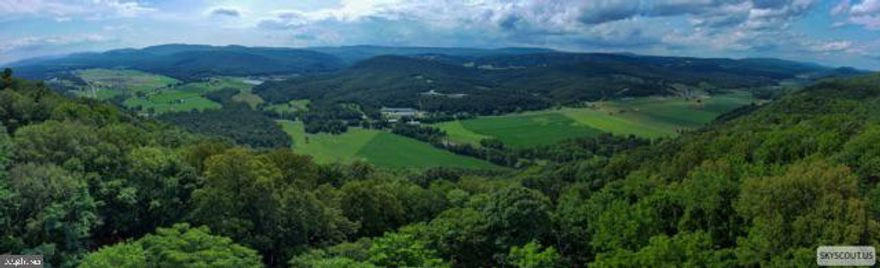 Discover an extraordinary opportunity to own 10 acres of gorgeous, undeveloped land on highly sought-after Toms Knob Approach in Lost River, West Virginia. Immerse yourself in the tranquility of the West Virginia mountains, with abundant wildlife and opportunities for hiking, hunting, fishing, biking and exploring nearby Lost River State Park and Trout Pond Area of GWNF. This is a rare chance to acquire one of the last remaining view lots in the coveted Lost River POA, offering breathtaking panoramic vistas that stretch for miles across the Appalachian landscape. Imagine winding down your day with vibrant sunsets painting the sky on your newly built screen porch or deck. This property boasts unparalleled, long-range mountain views that are increasingly scarce in the Lost River area. This expansive parcel provides a blank canvas for you to create your ultimate mountain retreat, whether it's a custom-built dream home, a secluded cabin, or a private sanctuary for outdoor enthusiasts.
Lost River, WV  is a charming community known for its serene environment, outdoor adventures, and a relaxed pace of life, yet remains accessible to larger metropolitan areas. This 10-acre parcel on Toms Knob Approach offers the perfect blend of seclusion and convenience. Don't miss out on the chance to own a piece of this dwindling natural beauty. This is more than just land; it's an opportunity to build a legacy and experience the best of mountain living. 
Nearby Attractions include: Lost & Found Pizza & Provisions, Lost River Farmers Market, Trout Pond Recreation Area, The Guesthouse of Lost River, The Lot River General Store, Lost River Yoga, Lost River Butcher Block, H&T Farmers Market, Lost River State Park.