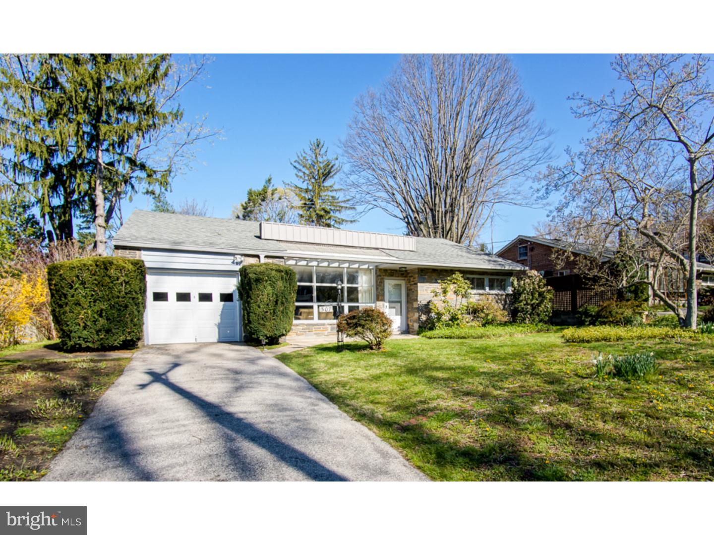 What a lovely home! All on one floor! Not showy. Just warm and welcoming. Not too big. But offering nice room sizes and a large office/family room addition in the rear with its own entrance/exit to the private rear patio. The house has two bedrooms PLUS a third room that one walks through to get to the addition. So an owner could have 3 bedrooms and a TV room OR 2 bedrooms, a TV room and a great office: very flexible floor plan! One enters a small vestibule with coat closet, then a sunny spacious living room with stone fireplace and beautiful oak flooring. The formal dining room leads to a cook's kitchen with lots of counter space and cabinetry, gas cooking, dishwasher, garbage disposal, appliance garage, refrigerator. A small utility room houses the HVAC system, the washer and dryer and storage area with exit to the rear patio. There are 2 bathrooms: one fully renovated hall bath with shower over tub; the master suite with 2 huge and 1 smaller closets offers the other fully renovated bath with shower stall. Gas heat, central air, lots of new windows, gleaming hardwood floors, security system. The grounds display many mature trees, flowering shrubs and perennials and go deep behind the house. One-car garage gives access to lots of storage space in the floored attic. Delightful location at the edge of the established Gowen Estate neighborhood of East Mount Airy, just steps from the Mt. Airy station of the Chestnut Hill East commuter rail line. Great restaurants, shops, and a variety of schools and places of worship dot the Mount Airy and Chestnut Hill community. Quick settlement possible. Easy to show.