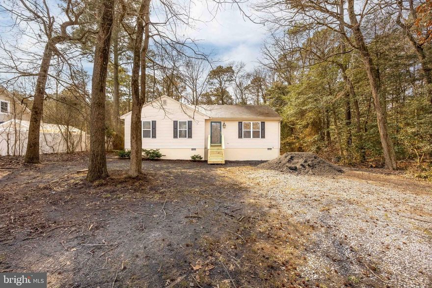 Welcome to this beautifully refreshed 3-bedroom, 2-bath home in Mardela Springs, offering 1,100 square feet of move-in ready living space! From the moment you step inside, you’ll appreciate the fresh paint, brand new luxury vinyl plank flooring, and cozy new carpet that make the space feel warm and inviting. The kitchen shines with brand new stainless steel appliances and granite counter tops & opens to a sliding glass door leading out to the deck—perfect for morning coffee or unwinding while overlooking the spacious backyard. The side entry opens into a functional mudroom/laundry area with built-in shelving for added storage. The primary suite offers a private bath with a walk-in shower.  Brand new front and side entry steps add the perfect finishing touch, offering both peace of mind and a warm, welcoming first impression. The large back yard offers endless opportunities for a pole barn, detached garage, garden, chickens. etc!