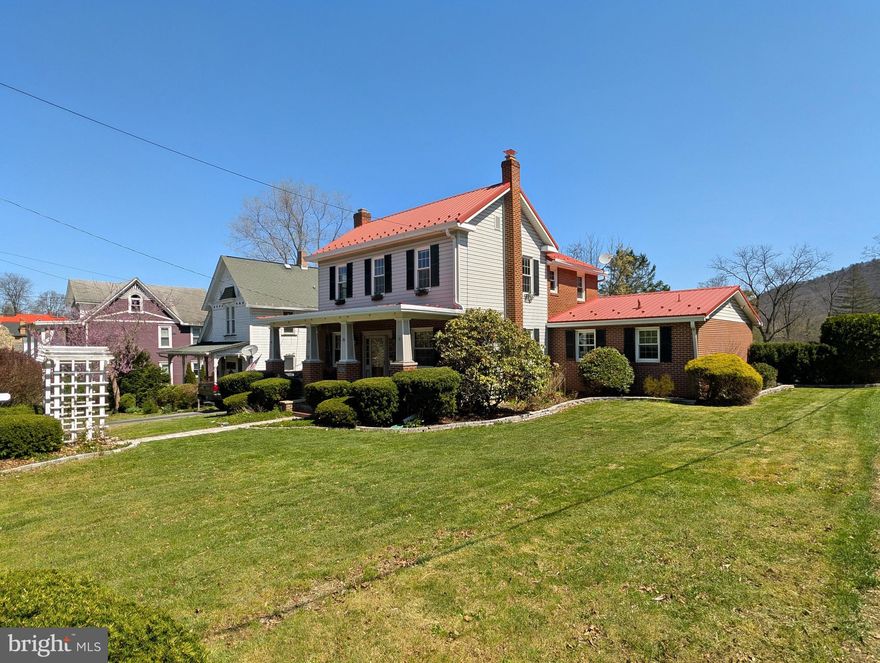 Welcome to this charming-- well-maintained 3-bedroom, 2-bath brick home with an attached garage in a highly desirable, walkable location. Enjoy peace of mind with updated electrical, newer windows, and a durable metal roof. The home offers a comfortable, functional layout and great natural light throughout. Outside, you'll love the fenced yard, perfect for pets or entertaining, along with two storage sheds providing ample space for tools, hobbies, or outdoor gear. Located within walking distance to downtown shops, dining, walking trails, and the Omni Bedford Springs, this property offers the perfect blend of convenience and small-town charm. An attached garage adds everyday ease, while the outdoor space enhances livability. Move-in ready with major updates already completed--schedule your showing today!