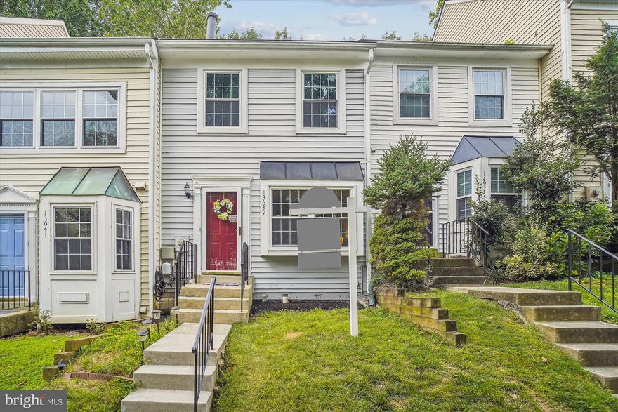 Deadline to receive offers is  08/02/23 by 12 pm. Step inside this beautifully designed home, featuring three finished levels with a walkout basement. The main level boasts beautiful hardwood floors. The spacious kitchen is a culinary enthusiast's dream, featuring stainless steel appliances, granite countertops, and contemporary white cabinets, creating a modern and stylish ambiance.
Indoor to outdoor flow is seamlessly achieved from the dining area to an elevated deck, offering a perfect spot to relax and enjoy the wooded outlook and filtered views of the lake. For cozy evenings, there's a fireplace to enjoy. 
Upstairs, you'll find two generous  bedrooms and two full bath. The Prime Bedroom is a true retreat, with skylights allowing natural light to flood the room and an ensuite bathroom for added convenience and privacy,  another  plus is dressing area and a huge closet .
The finished basement offers ample living space with a half bath and two separate rooms, which can be utilized as an office, playroom, storage room, or even a third bedroom or recreation room. The options are endless to suit your needs and lifestyle.
The outdoor space is equally impressive, with a private rear patio and a fully fenced yard that backs onto parkland and the serene lake, providing a perfect blend of nature and tranquility right in your backyard.

This is truly a must-see property, offering not only a beautiful residence but also a wonderful opportunity to enjoy lakeside living at its finest and hike on the tree-lined path. Don't miss the chance to make this exceptional home yours! Conveniently located near major highways, I-270 shopping malls, and restaurants, this home offers the perfect combination of comfort and accessibility.