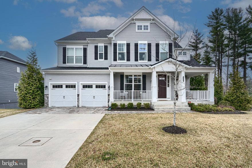 This beautifully designed home was the Model Home for this charming, recently built community of 32 luxury houses.  Warm and welcoming describe each light filled room from the grand high ceiled foyer to the landscaped surroundings. The gourmet kitchen features an expansive island, 2 sinks, 2 dishwashers,  a 5-burner gas cooktop and a high-end KitchenAid double wall oven/microwave (Energy star rated). Perfect for entertaining, the open concept floor plan includes a large breakfast/eat-in area and a great room flanked by an inviting gas fireplace. The private dining room ​overlooks the cozy sitting area, leading back to the entrance​ and open office area. The second floor bedrooms and full baths are equally charming and roomy. Networked for any large screen or other technology​, the grand primary bedroom opens to a sitting area and spa bathroom. The laundry room is conveniently located on the same level.   Whirlpool washer/dryer and a separate Whirlpool dryer. No absence of light or space in the bottom club level either.  Make it into an extra family area or home theater room. Another bedroom and full bathroom can be used for in-laws or a nanny. Full house music wired and zoned to play your choice of any streamed music.  Looking for curb appeal and outside enjoyment? Check out the cozy front porch, the main level deck and ground level paved patio — all surrounded by conserved green spaces. Convenient location with easy access to nearby major travel routes, shopping, walking paths, trails and tree lined streets. As the model home it is filled with almost all the available upgrades, including upgraded cabinets and tile backsplash in the kitchen, upgraded carpet, stair runner, a full security system with 6 cameras and a video doorbell, trex deck on the back, and a programmable lawn irrigation system. All art and furniture were part of the model home, and are also available to be conveyed separately to keep the designer look of the house.  Investigate your options to assume a low interest rate VA loan.  It may be assumable for the right buyer-possibly a non-Veteran as well.