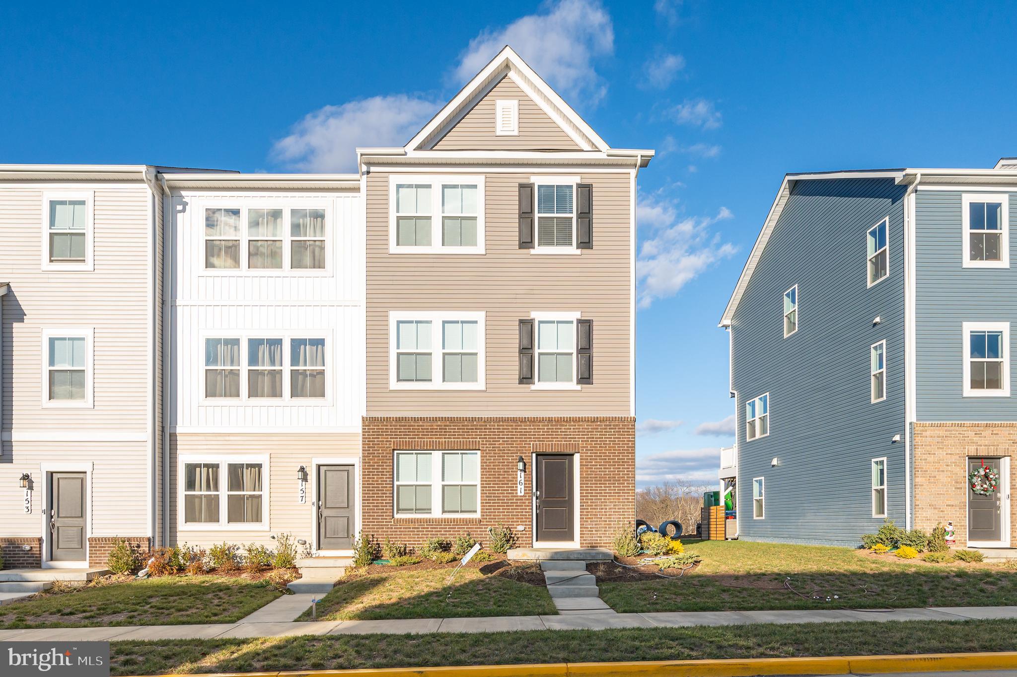 This end unit townhome features three levels of immaculate living space. You also have a TWO car garage, nearly unheard of in a townhome! The lower level of the home features LVP flooring in the spacious family room and powder room. The main level features an open floor plan with LVP floors throughout. The large family room has lots of windows for tons of natural light. The ceiling fan light fixture keeps the space airy. There is a convenient half bath in this space with a pedestal sink. The living room is open to the kitchen and dining room. This is a great set up if you like to entertain. In the kitchen have classic finishes with white shaker cabinets, granite countertops, and a white subway tile backsplash. The huge island provides extra prep and storage space along with breakfast bar seating for up to four. Beyond the island you have a spacious dining room with overhead lighting. This space also features access to your large rear deck. This is the perfect space for Summer BBQs or just enjoying the sunshine in warmer months. The upper level of the home features a carpeted hallway with a convenient laundry closet. This keeps your machines nicely tucked away and provides ample storage. Down the hall you have two generously sized bedrooms featuring carpet, large closets, and overhead lighting. The hall bath features a white shaker single bowl vanity and 5 ft tub/shower with tile surround. The primary suite features carpet, ceiling fan, and recessed lighting. The private ensuite includes LVP floors, double bowl shaker cabinet vanity, and a 4 ft should with tile surround and bench seat. The suite is completed by a walk-in closet. You will want for nothing in this beautiful home. Schedule your showing today!