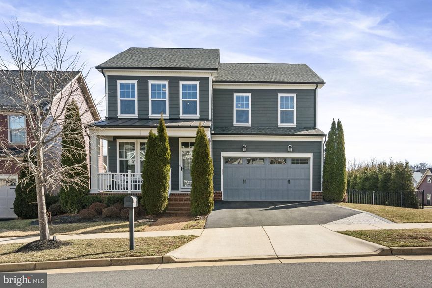 Beautiful Single Family Home with MANY custom features! This home features a large fenced corner lot allowing so much natural light to pour in. The custom features allow comfort & functionality to come together in this open-concept home. Upon entering you immediately notice the high ceilings, crown molding, large windows, freshly painted walls, and gleaming REAL  hardwood floors that flow throughout the main level. Off the family room is a beautiful open kitchen with a very large working island complete with granite countertops, linen cabinets, and stainless appliances. The main level comes with a mud room off the two-car garage for easy access and storage items. As you make your way upstairs, the primary suite is to the right, and the UPDATES include newly installed hardwood floors,  Custom floor to ceiling built-in TV/Desk area, a large, walk-in ORGANIZED  CUSTOM closet system, and an updated AMAZING SPA-LIKE bathroom that you have to see for yourself equipped with custom rock floor in the shower, additional cabinets space, custom lighting, and jetted soaker tub! Additionally on this level are two other generous-sized bedrooms, an updated bath, and an upper-level laundry room complete with a washer & dryer. The lower walk-out level has a workout room, a fourth large bedroom TO CODE, and an en-suite full bath. The rec room is perfect for adult gatherings with a gorgeous bar also equipped with mini beverage fridge, and automatic ice maker, perfect for friends and family to entertain! This home includes over $130,000 in amazing upgrades including a custom deck and stamped concrete patio with connecting stairs that spill into the large corner lot with a fully fenced backyard, in-ground irrigation system, and professional landscaping. Make this your home and enjoy the world-class amenities that POTOMAC SHORES has to offer, including the state-of-the-art fitness facilities, Jack Nicklaus Signature Public Golf Course and Tidewater Grill, 2 swimming pools, social facilities, 5+ miles of walking trails, canoe/kayak launch and well planned and extremely well-attended community activities. Both the elementary (Covington-Harper) and Potomac Shores Middle school are located within the community as well as John Paul The Great private high school and the Ali Krieger Sports Complex. A VRE station construction has begun, and the town center are underway. The combination of this beautiful home and all the amenities available in Potomac Shores, makes this a wonderful place to call home!