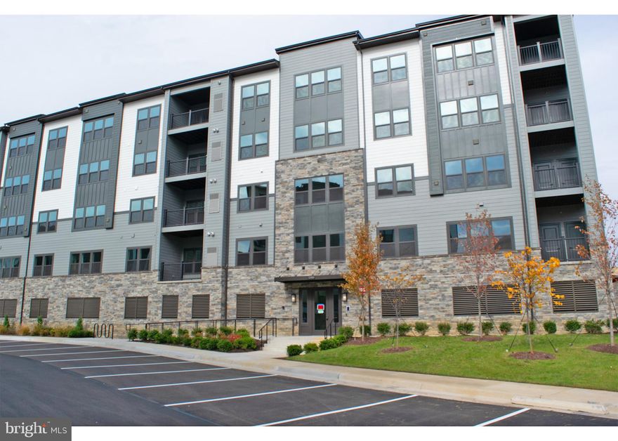 Beautiful 2 bedroom 2 bath condo located in the heart of Herndon. Featuring upgraded kitchen with stainless steel appliances and granite counter tops. Spacious living area with luxury flooring and lots of natural light. Primary bedroom features walk in closet and private en suite. Covered balcony with privacy included. Home in conveniently located close to major highways and public transportation. Includes one covered garage parking space. A Must See!!!