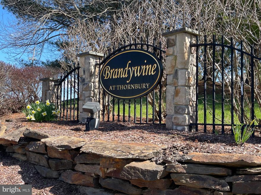 This is the home you’ve been waiting for... located on a beautiful cul-de-sac complete with a welcoming front porch and nestled in sought after the Brandywine at Thornbury community. This spacious 4BR / 2.5BA West Chester home plus a large office delivers the perfect mix of a fantastic location and style. It is conveniently located minutes from downtown and tax-free shopping in Delaware. This home has been meticulously maintained and is the largest model within the community at over 4,500 sq ft including a finished lower level with a bath rough-in and large storage area. Step inside and you’re greeted by a bright, two-story foyer with hardwood floors and a sweeping staircase that instantly feels like home. The open flow into the living and dining spaces makes entertaining easy, which extends also into the open floor plan kitchen and two-story family room with a gas fireplace. The large office also could be utilized as a main floor guest bedroom or playroom. The kitchen is where things really come together—light-filled, functional, and open to the spacious family room. Stainless steel appliances, Great kitchen storage spaces with one smaller pantry as well as a very large walk-in pantry. Natural gas heat and central air. Picture cozy nights by the gas fireplace or weekend hangouts that spill right out onto your patio with a cozy gas firepit. Upstairs, the primary suite is your personal retreat with a sitting room, two large walk-in closets plus a spa-like bath featuring a soaking tub, two vanities and a separate toilet room as well as a linen closet. Three additional bedrooms and a lovely hall bath give you flexibility for family, guests, a home office, or whatever your lifestyle needs. The finished basement? Total bonus space. Think gym, playroom, media room, or all of the above. Plus, extra storage to keep everything organized and out of sight. Recent updates mean less stress and more living—fresh paint in many rooms and a newer roof to mention a few recent updates. Brandywine at Thornbury is packed with perks— such as community pool, tennis courts, basketball court and playground. Close to everything you need but tucked away where you want to be. Minutes from shopping including the Amish Market, Acme, Whole Foods and Planet Fitness as well as the great restaurants all throughout West Chester.