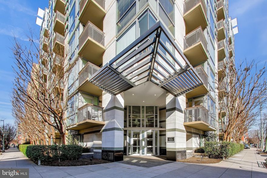 $25K PRICE IMPROVEMENT!  Perfectly positioned in Logan Circle, this sun-filled corner residence at Solo Piazza offers nearly 1,500 square feet of elevated, one-level living—designed for how today’s buyers live, work, and entertain. From the moment you walk in, natural light pours through walls of windows, creating a warm, open atmosphere that feels both expansive and inviting. The main living and dining areas flow effortlessly together, making this home as ideal for hosting friends as it is for a quiet night in.
The kitchen balances style and function with high-end stainless appliances, a built-in pantry, and seamless connectivity to the main living space.

The thoughtfully designed layout offers two true bedroom suites, each with its own sense of privacy, while a flexible third room provides the perfect home office, guest space, or creative studio. The current owners reimagined the primary bath to create a private ensuite bath with fresh spa-inspired updates and extra built-in storage. 

Two private balconies extend your living space outdoors, creating the perfect setting for morning coffee or evening unwind. Additional features include garage parking, in-unit laundry, updated HVAC, and a separate storage unit in the garage. Located just steps from some of DC’s most sought-after dining, fitness, and nightlife along 14th Street, this home offers not just a place to live—but a lifestyle that’s hard to match.