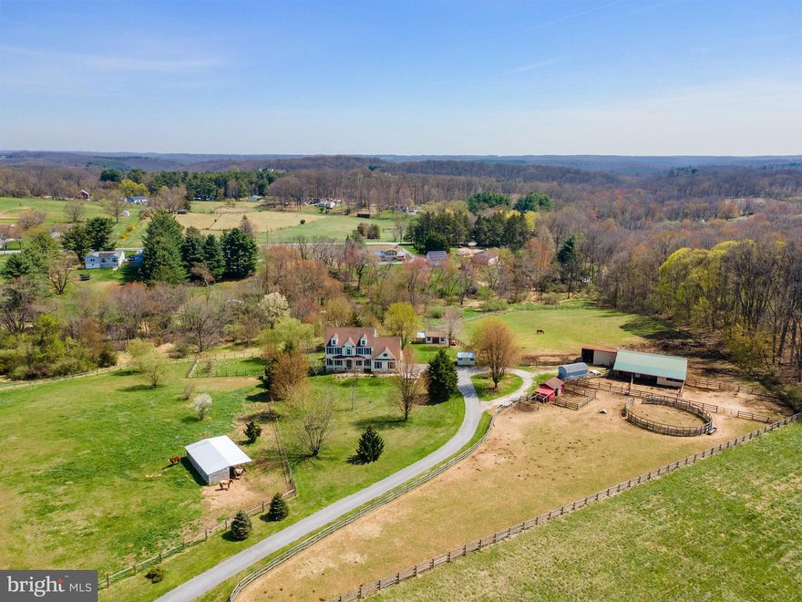 Open House Sunday (4/12) from 1-3PM!! Your turnkey farmette and homestead awaits you on 11.75 acres in the Hereford Zone! A myriad of both indoor and outdoor amenities make 4525 Beckleysville Rd a fit for so many lifestyles. Down the long private drive, a wonderful 2006 center foyer colonial greets you, perfectly secluded in the center of the property. With over 6 acres of fenced pasture, a center aisle barn with 5+ stalls with overhangs on either side and run in/out capability, round pen, multiple run-ins, and additional hay and storage buildings, the livestock and animals can move right in. There are also chicken coops, fruit trees, a pond at the front of the property, and a stream running through the rear. The backyard is fully fenced into multiple sections. Inside find wonderful spaces, a flowing and functional floorplan, and nice updates. The refreshed kitchen contains a large center island, newer appliances, and is open to the cathedral ceiling living room and also contains a slider to the 3-season room. There is a large, walk-in pantry, first floor laundry that could be converted back into an office or bedroom, and two other large living spaces - formal dining, sitting room, office - whatever you need! Updated flooring spans the first floor. There is also an oversize 2 car attached garage with direct access through the pantry/mud room to the kitchen. Upstairs, the primary suite features a large private bath with separate tub and walk-in shower, water closet, and dual updated vanities. There is a large walk-in closet and bedroom-size bonus room over the garage - perfect for a private at-home office, nursery, en suite sitting room, craft room, and more. The upstairs is completed by 3 sizeable bedrooms off the center hall which is open to the foyer, and an additional full bath with tub/shower combination. The fully finished basement contains updated flooring, a true bedroom with its own en suite full bath, a walkout to the backyard, and numerous finished rooms for additional living or storage space. There is a covered hot tub overlooking the back yard steps outside the basement slider door. With 5 bedrooms, 3 full baths, and lots of additional spaces, this highly adaptable floorplan is waiting for your personal touches, reconfiguration, and use of space to fit your every day. Outside is brimming with possibilities, with so many outbuildings, storage spaces, and varied terrain with both open pasture, wooded acreage, and two water features between the stream and pond (fishing awaits!). 4525 Beckleysville truly combines everything you'd want in a property that offers just as much outdoors as it does indoors, for a true combination of today's rural suburban lifestyle with a newer home. Your farmette dreams are ready to be realized!