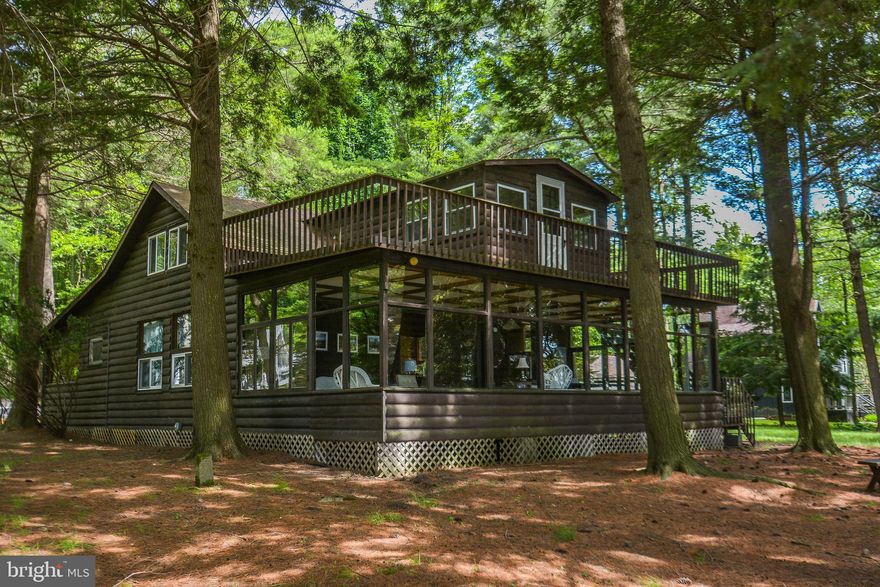 If you are looking for stunning lakefront, this is it! Offering  330' of level lakefront, and 1.28 acres, the possibilities are truly endless. The current home could be renovated, or you can start from scratch and build your dream home. A four-bedroom BAT septic system has been approved, making it one step easier to build.  With the lake waters steps away and a Type A dock permit, there is so much for you and your family to enjoy. The detached three car garage offers a studio apartment above it. The Thousand Acres community is truly a serene part of Deep Creek Lake and has a very impressive golf course. The location is peaceful and serene, and within 15 minutes of shopping and dining in Oakland or DCL. Call today to preview this rare find!