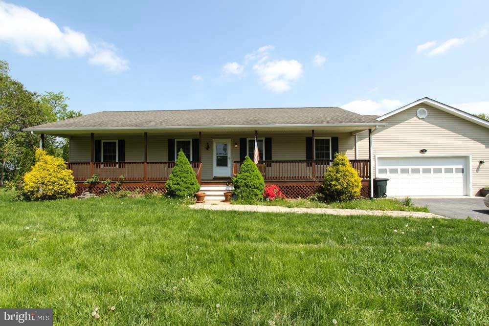 This charming rancher features front and back decks, a large two car garage and fenced backyard. The home has an open floor plan with a large dining/living area. The kitchen offers newer appliances and beautiful countertops. The bedrooms have brand new carpet and spacious closets, the master has a private vanity as well. Full unfinished basement and easy commuter location.