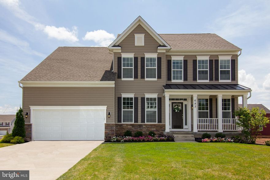 STONEGATE COMMUNITY.  Very Desirable Neighborhood. Enjoy the quiet and beautiful views of this large 2 story  Colonial. Lots of space for entertaining. Only 2 years old.  4BR, 4 1/2BA. Formal Dining room and living room. Den/Office on Main level. Large family room with Open floor plan. Eat in country kitchen with granite countertops leading out to a large maintenance free deck for family cookouts. Convenient laundry room off kitchen.  Fully finished basement with lots of room for entertaining.  Full bath in basement. Extra room for office, exercise or media room.  Possibility for 5th bedroom in basement.  Lots of storage in basement. Walk out basement has upgraded French door. Very Large Master Bedroom with very large walk in closet.  Master bath has tub and shower. 2 Car garage.  Also Custom Window Treatments throughout.  Fenced in backyard.  This one won't last long. Come preview this beautiful home and you won't be disappointed. Enjoy Carroll County living.