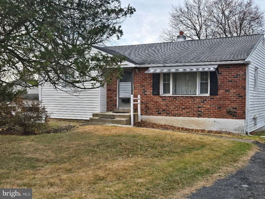 Living & dining combo, kitchen with eating area, wood cabinets and door to rear yard