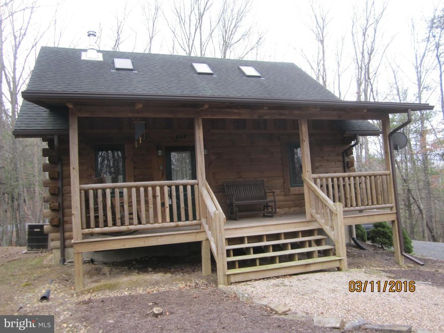 Authentic Log Home on a gently sloping .68 ac lot with mtn views, this 1274 sq ft, 12 years old, 2br/2ba also has sm family rm on the upper level. The wood floors are gleaming and the 2 story open living room has a  stone chimney,wood paneled walls and an open stairway with 3&1/2 inch thick wood steps. The home is in perfect condition with all furniture, linens and essentials conveying. A must see