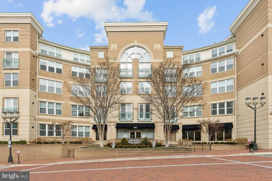 Welcome to main-level living at its best in this rarely available Davenport model. This spacious, updated, and move-in-ready 2-bedroom, 2-bathroom condo features an oversized brick patio and is located in the highly sought-after Savoy at Reston Town Center. Enjoy being steps away from vibrant dining, shopping, the Metro, major highways, Dulles International Airport, local hospitals, and so much more.

The unit offers an open floor plan with two primary suites, updated bathrooms with modern LED lighting, and a custom walk-in closet in the main primary suite. The interior is finished with hardwood floors and a gourmet kitchen featuring quartz countertops, a large island, premium cabinetry, and modern appliances. Additional highlights include a buffet cabinet with a built-in wine cooler, recessed lighting throughout, a large pantry, a dedicated laundry room with a modern washer and dryer, a 2025 AC air handler, and a newer hot water heater. The oversized brick patio provides direct access to the building's courtyard with plenty to offer.

The unit is conveniently positioned near the elevator, pool, gym, and trash room, and it includes two side-by-side parking spaces located close to the elevator. Additional street parking is available via the PARK RTC app.

The Savoy offers state-of-the-art amenities, including a secured building with concierge service, a modern gym, an outdoor pool, a game room, multiple lounges, and community spaces—all within walking distance of everything Reston Town Center has to offer.

Don't miss this opportunity. Call or text to schedule your private showing today and be sure to view our video and 3D tours.