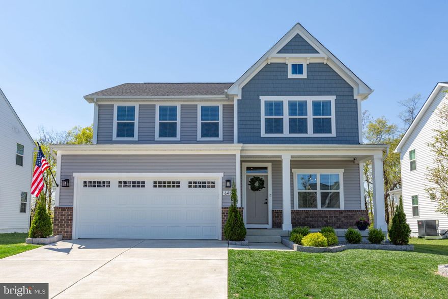 Nestled in the charming Hopyard Farm community with picturesque views of the Rappahannock River, this stunning 5-bedroom, 3.5-bath home offers the perfect blend of comfort, elegance, and modern living. Built in 2024, its timeless traditional architecture and inviting front porch create a warm, welcoming first impression.

Step inside to an open-concept floor plan designed for both everyday living and effortless entertaining. The spacious family room flows seamlessly into a gourmet kitchen featuring upgraded countertops, a striking marble herringbone backsplash, an oversized island, and stainless steel appliances—including a built-in microwave, range with oven, and an additional wall oven.

The thoughtfully designed breakfast area showcases a custom built-in banquette with storage, while the adjacent beverage station/butler’s pantry—complete with a beverage fridge, additional cabinetry, and counter space—adds both style and function. A separate dining room offers flexibility for formal gatherings or can easily serve as a private home office or study.

Upstairs, the serene primary suite provides a true retreat, complete with river views, a spacious layout, a luxurious Roman shower, and generous closet space.

The fully finished basement expands your living options with the perfect space for a game room, home theater, or additional lounge area. In the main living space, an electric fireplace with a custom locally crafted wood mantel adds warmth and character.

Outdoor living here is truly exceptional, offering a perfect balance of tranquility and space. Start your mornings with a cup of coffee on the covered back deck, unwind in the evenings beneath the gentle breeze of the ceiling fan, or host gatherings on the expansive stamped concrete patio complete with a built-in firepit. The property is beautifully framed by mature trees, creating a private, scenic setting with breathtaking glimpses of the Rappahannock River just beyond.

One of the most remarkable features of this home is the frequent presence of bald eagles soaring overhead. These majestic birds are known to nest along the Rappahannock, and it’s not uncommon to see them gliding gracefully above the backyard or perched high in nearby trees. Their presence adds a rare and awe-inspiring touch to the natural beauty of this property, making it a truly special place to call home.

Residents of Hopyard Farm enjoy access to a community swimming pool, summer swim team, parks, walking trails, tennis courts,  fitness center and planned social events throughout the year. 

Ideally located just off Route 3 between Fredericksburg and Dahlgren Naval Base, this home offers both peaceful seclusion and convenient access. Commuters will appreciate the easy drive—approximately 25 minutes east to I-95—making daily travel simple while still enjoying a serene, nature-filled setting.