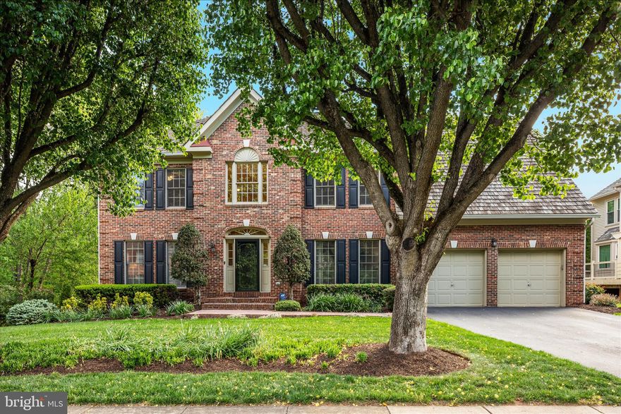 Welcome to this stately and beautifully updated colonial—offering the space, upgrades, and setting today’s buyers are searching for. From the moment you enter the dramatic two-story foyer, you’ll notice gleaming hardwood floors and an inviting, light-filled layout designed for both everyday living and effortless entertaining. The MAIN LEVEL centers around a gourmet kitchen with a large island, stainless steel appliances, and granite countertops, flowing seamlessly into the spacious family room with vaulted ceilings and a cozy brick fireplace. Formal living and dining rooms with elegant moldings and bay windows provide refined gathering spaces, while a private office with French doors offers the ideal work-from-home retreat. UPSTAIRS, the expansive owner’s suite is a true sanctuary, featuring a private sitting room, dual customized closets, and a beautifully renovated spa-like bath with a soaking tub, walk-in tile shower, and dual quartz vanity. Three additional spacious bedrooms with hardwood flooring and an updated hall bath complete the upper level. The fully finished walk-out LOWER LEVEL adds nearly 1,500 square feet of versatile living space, complete with a full bath, wet bar with granite counters, and abundant room for recreation, guests, or hobbies. OUTDOOR living shines with a screened porch, deck for grilling, and a lush, landscaped yard supported by an irrigation system—perfect for relaxing or entertaining. An oversized two-car garage adds convenience and storage. Ideally LOCATED near trails, major commuter routes, shopping, and Dulles Airport, this exceptional home offers the perfect blend of elegance, comfort, and convenience. Don’t miss your opportunity to make it yours today.