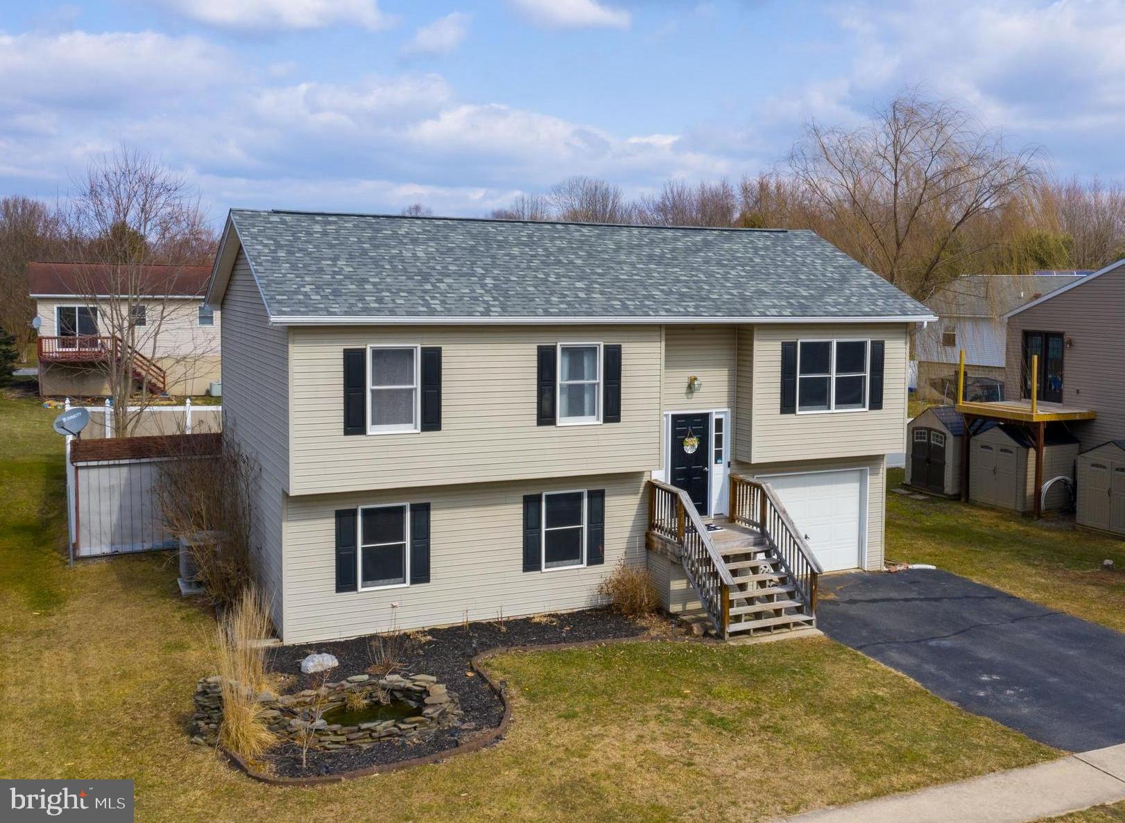 Located on a cul-de-sac in Northeastern School District is where you will find this 3 bedroom, 2 full bath split foyer home featuring an awesome fenced in back yard!! New roof installed in 2019 with a 30 year transferable warranty is a plus! Nice kitchen with center island, breakfast bar and all appliances. Directly located off of the kitchen is the dining room with a door leading out to the rear deck. Large living room featuring new carpet! Three nice sized bedrooms can also be found on the main level along with a full bath. As you journey downstairs you will be greeted by a spacious family room with wet bar and full bath. This is the ideal spot to entertain!! Just in time for summer fun, enjoy relaxing and making s'mores around the beautiful fire pit area. Decorative fish pond with waterfall feature, attached one car garage and storage shed. Open main level layout makes entertaining a breeze. Schedule your private tour today before the SOLD sign goes up!