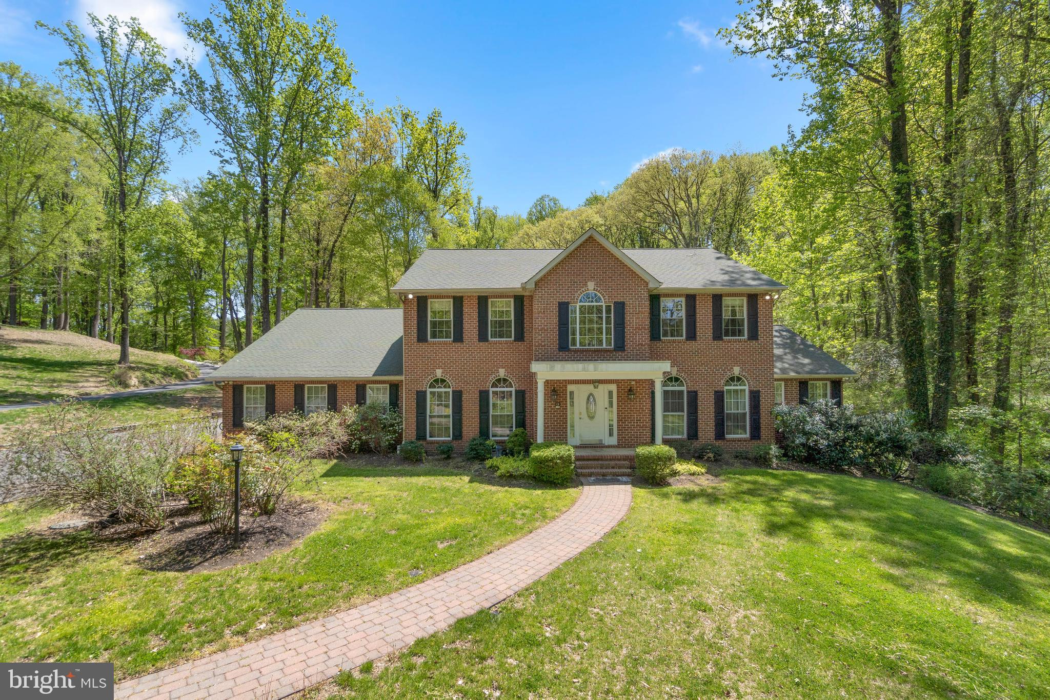 Fantastic opportunity to own a grand colonial in Crownsville. Stately brick front colonial with 4 bedrooms and 3.5 bathrooms on a private 2 acre lot. Main level offers a separate in law or au pair suite in addition to an open concept kitchen and family room, formal dining room and private study complete with dual sets of french doors plus a large sunroom with vaulted ceilings. Expansive deck backing to open space with wooded area behind runs the length of the home. Upper bedroom level overlooking 2 story foyer features impressive primary suite with a Juliette balcony, large bathroom with soaking tub and separate shower dual sink vanity, walk in closet and dressing room. 2 additional bedrooms connected with Jack & Jill bath.
Oversized 2 car, side entry garage. Large unfinished basement with separate built in shed/utility area. A little work and some cosmetic improvements will go a long way! Schedule your private tour today!