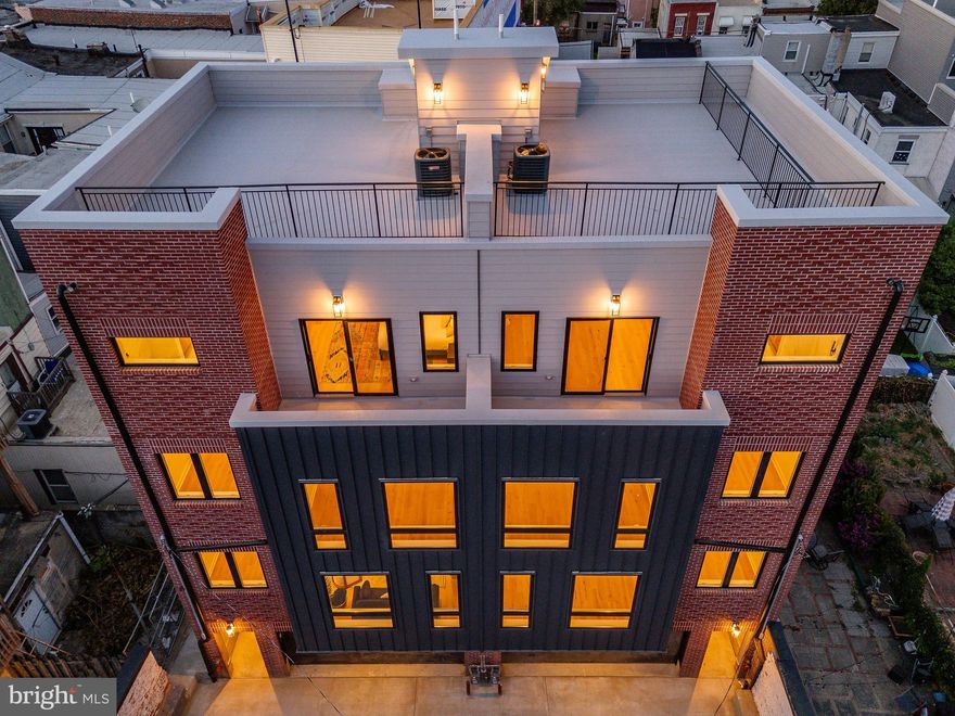 Discover an extraordinary blend of luxury, space, and convenience in this stunning new construction home in South Philadelphia! Designed with a double-wide layout, this home is flooded with natural light from every angle, creating a bright and airy atmosphere that feels both grand and inviting.
Boasting 4 spacious bedrooms, 3 full baths, and 2 half baths, this meticulously designed residence offers an abundance of thoughtfully curated living space across multiple levels. The chef's kitchen is a showstopper, featuring top-of-the-line Thermador appliances, a walk-in pantry, and an open layout that is perfect for both intimate dinners and large gatherings.
The primary suite is a true sanctuary, complete with a massive walk-in closet leading to a spa-inspired bath, where you can unwind in an oversized shower and soaking tub. Every detail has been considered, from the large laundry room to the ample storage and custom-built closets throughout.
Step outside to enjoy four private outdoor spaces, including a breathtaking roof deck with panoramic views of the Philadelphia skyline, and the Stadium, home of the World Champion Ealges! The roof deck is a perfect backdrop for entertaining or relaxing. Parking is a breeze with a two-car garage and potential for additional secure guest parking, an absolute rarity in this sought-after neighborhood.
Tucked away from the street for ultimate privacy, yet just steps from South Philly's vibrant culture, renowned restaurants, and the iconic Mummers tradition, this home offers the perfect balance of city living and serene retreat.