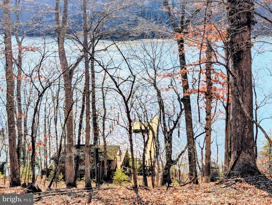 OPEN HOUSE, Sat, March 7, 2-4pm...Welcome to this lovely, affordable waterfront ranch home and boat house at water's edge in the highly sought-after community of Bon Haven, sited on over one acre of tranquil land along the scenic South River.  Zone R2 with possible subdivision (check w/county). Thoughtfully renovated and featuring a newly constructed private pier with swimming deck ready for your boat or jet skis! This property offers an outstanding lifestyle for boating enthusiasts and nature lovers alike.

Upon arrival, you are welcomed by an expansive front lawn, a generous driveway leading to this beautiful brick home and charming front porch. Inside, beautifully refinished hardwood floors flow throughout the main living areas, creating warmth and continuity. The living room/formal dining showcases a wood-burning fireplace with a custom marble mantel and large picture windows that flood the space with natural light.

The oversized family room offers an additional wood-burning fireplace with a custom wood mantel and provides direct access to the fenced rear yard, waterfront views, and private pier. This inviting space also connects seamlessly to the attached two-car garage.

The renovated eat-in kitchen is both stylish and functional, featuring custom cabinetry, granite countertops, new luxury vinyl plank flooring, and newly installed Roman shades that enhance the abundance of natural light.

Down the hall, the private primary suite includes an en-suite bathroom and walk-in closet. Two additional generously sized bedrooms and a spacious newly updated hall bathroom provide ample accommodations for family and guests.

The lower level offers a large 4th bedroom, office, gym or playroom and unfinished space with laundry and abundant storage space, ready to be customized to suit your needs and imagination.

Recent updates include a remodeled kitchen, new HVAC system, water heater, and water softening system, privacy fencing, fresh paint, updated flooring, and a newly built private pier. The property also includes a charming chalet/boat house used by the Sellers for crab feasts and overnight guests.

Enjoy a wide range of water activities on the South River, including power boating, kayaking, canoeing, sailing, waterskiing, swimming, fishing and crabbing! This remarkable property offers the perfect opportunity to experience the beauty of waterfront living throughout all four seasons.

Schedule your private tour today and discover everything this exceptional home has to offer.