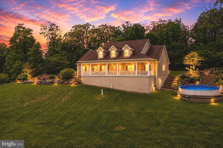 MOTIVATED SELLER!!   Welcome to The Million Dollar View—a custom-built 2006 Cape Cod retreat perched on 12 private acres atop the mountain in Frederick County, Maryland. This stunning 4-bedroom (with a main-level primary suite), 4.5-bath home offers over 5,130 sq. ft. of finished living space, breathtaking sunrise and sunset views, and exceptional craftsmanship throughout. Built with meticulous care by the owner, this residence showcases quality upgrades, spacious rooms, and endless potential both inside and out. No HOA and no restrictions. Inside, the main level features a grand two-story foyer with a beautiful staircase, a formal dining room, a private office with a closet, and a spacious living room centered around a wood-burning fireplace. The luxury kitchen boasts abundant cabinetry, a double oven, generous counter space, and gorgeous views from every window.  The main-level primary suite includes tray ceilings, abundant natural light, a large walk-in closet, dual vanities, a soaking tub, and a separate shower.  Upstairs, you’ll find three additional bedrooms and two full bathrooms—one being a convenient Jack-and-Jill layout—plus excellent storage throughout. The fully finished lower level offers outstanding versatility with a custom bar, full bathroom, gym/workshop space, large storage rooms, and the potential to create two additional bedrooms or an in-law style suite.  Outdoor amenities include an above-ground pool with vinyl decking and railings, a wide front porch overlooking panoramic mountain views, a three-car attached garage, a poured foundation ready for a future detached garage, an outbuilding for wood/storage, dual-zone heat pumps, and Verizon high-speed internet. You’ll also love the custom-built outdoor grill—perfect for summer entertaining.  This property is ideally located near Cunningham Falls State Park, High Rock, Thurmont Community Park, local restaurants, and major commuter routes. High Rock is one of the area’s most popular scenic hiking destinations, making this home a paradise for nature lovers and outdoor enthusiasts.  Seller will need a home-of-choice contingency. Don’t miss this rare opportunity to own a custom-built mountain-top estate offering unmatched views, privacy, and spectacular potential.
