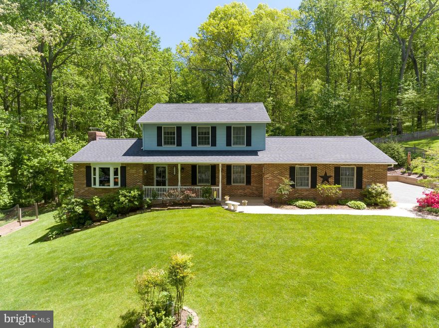 Immaculate Home on 1.4 Acres! This 3 bed, 2.5 bath home sits on a secluded lot with a 2 car garage. Custom landscaped yard w/ front porch, rear deck & patio to enjoy views. Spacious family room has skylights & sits off of the eat-in kitchen. ALL baths are REMODELED & kitchen has granite counters w/ pantry closet. Finished basement that leads to a stamped concrete patio makes the dream come true!