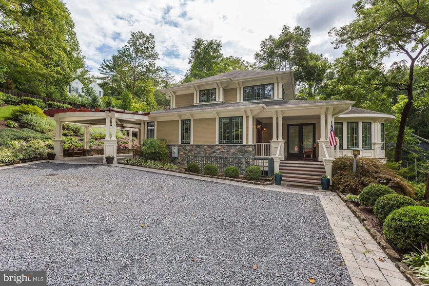 Truly one of a kind! Art as architecture...Gated drive to custom built (2002) residence prominently sited on impressive wooded lot affording ultimate privacy & seasonal river views. Many special features including elevator,new mstr bath, dramatic hillside water fall, stone patio & porch, curved great room w/unparalleled views, extensive exterior lighting,generator, pool membership, & so much more!